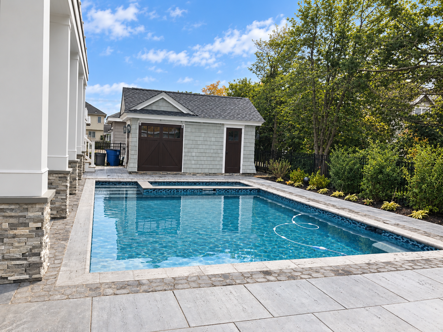Backyard pool with landscaping and pool house, Stone Harbor NJ custom home