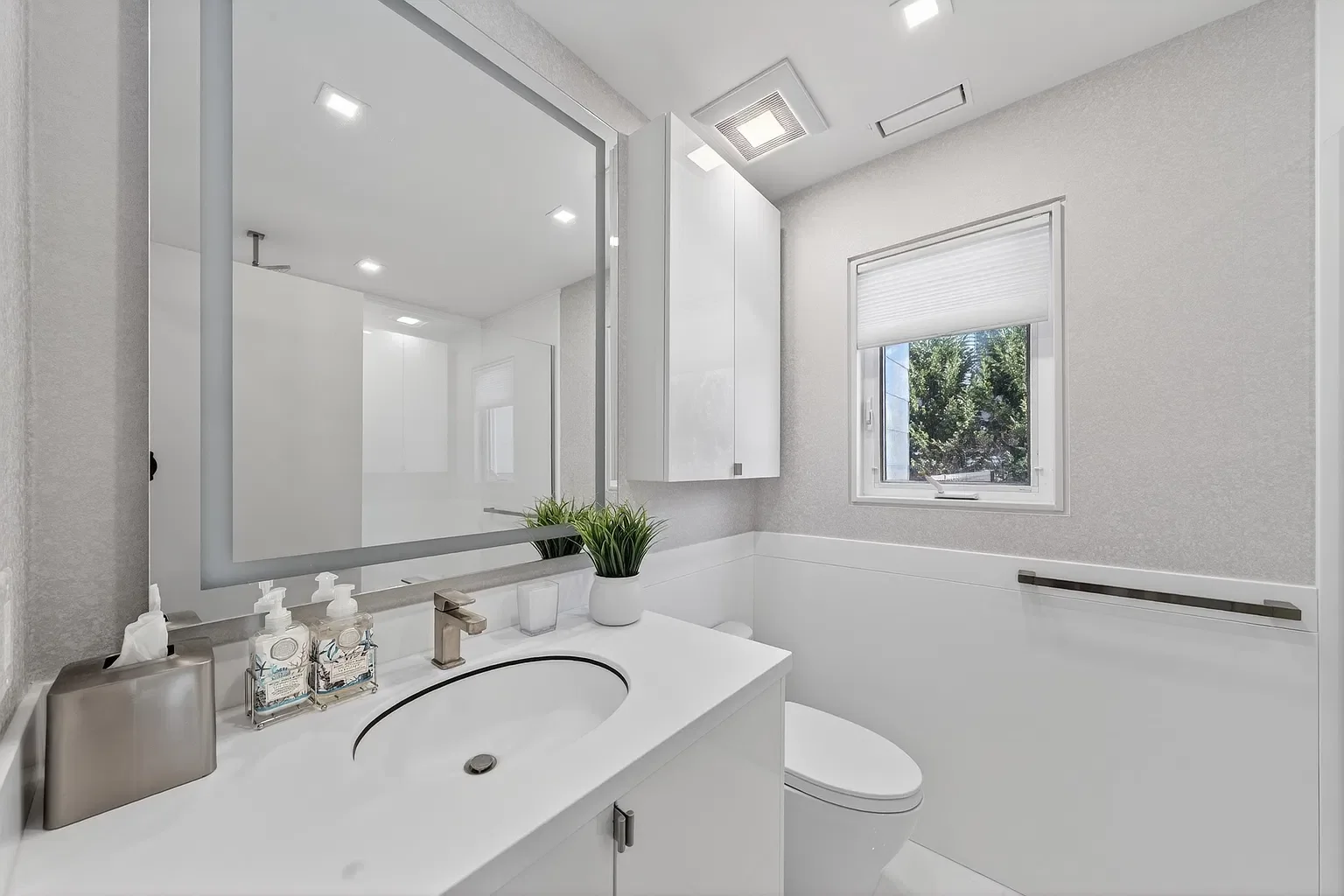 New bathroom with a white vanity and lighted mirror, 107 116th St, Stone Harbor, NJ