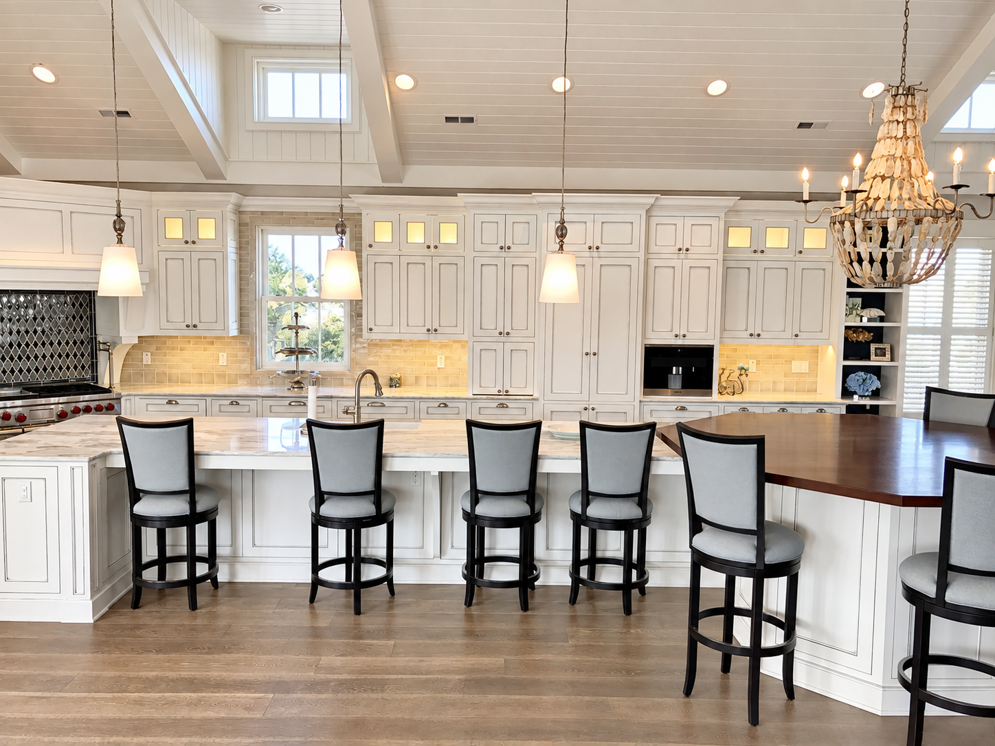 White kitchen with island seating and beaded chandelier, Stone Harbor NJ