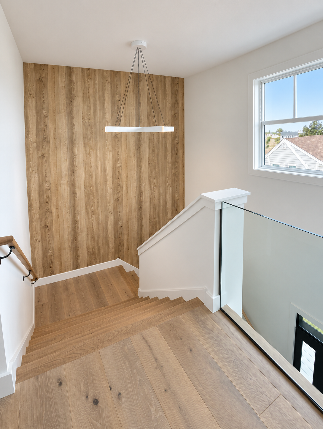 Oak staircase with a glass railing in the new custom home, 251 Crescent Rd, Ocean City, NJ