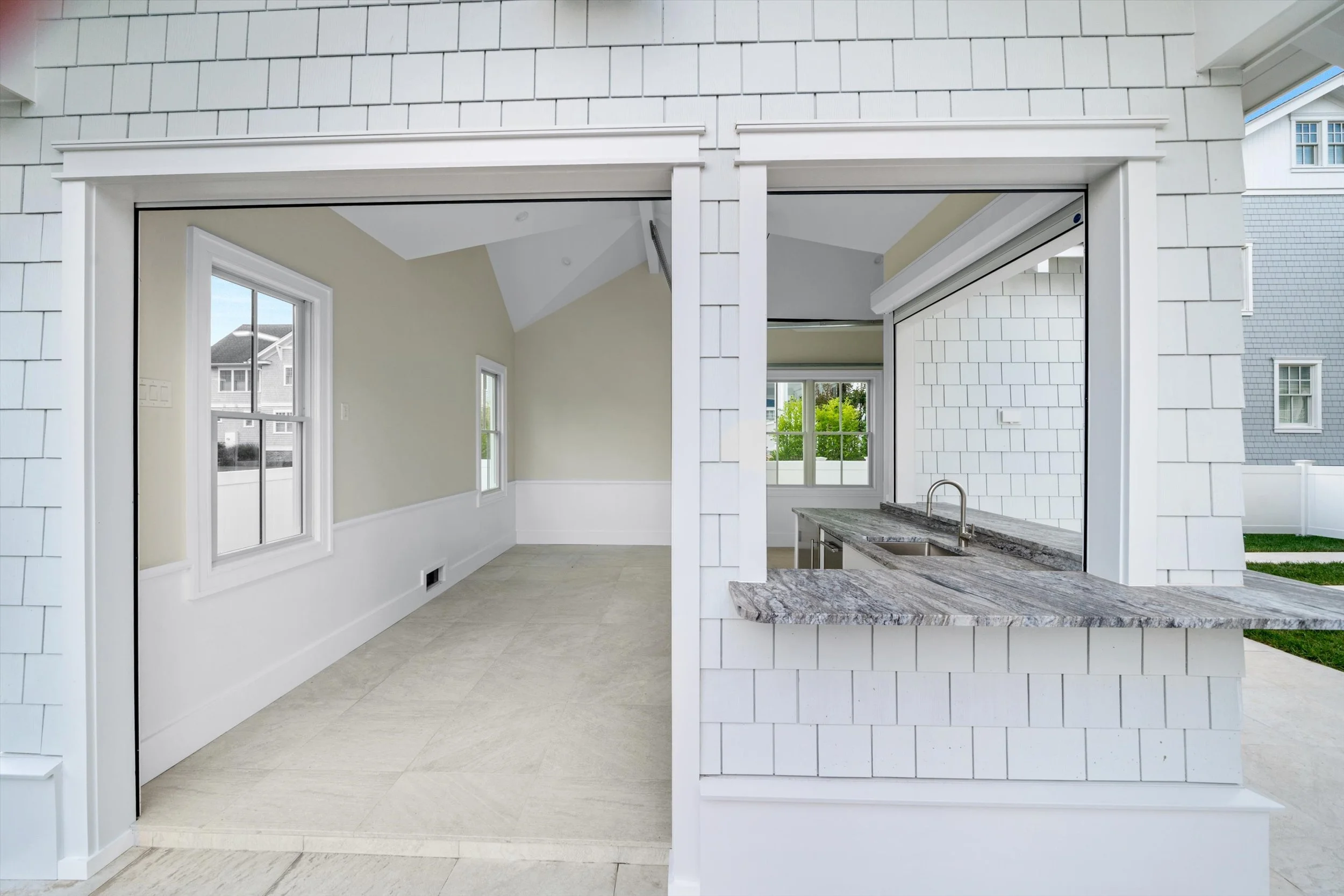 Inside the pool cabana, with wide openings to the patio, 245 57th St, Avalon, NJ