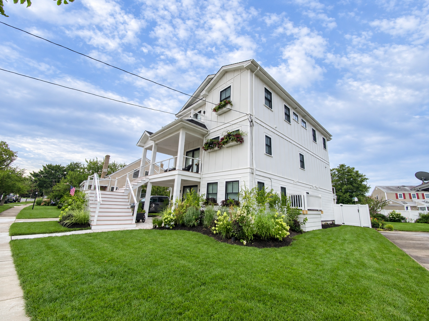 Corner view of the new custom home with window boxes and landscaping, 251 Crescent Rd, Ocean City, NJ