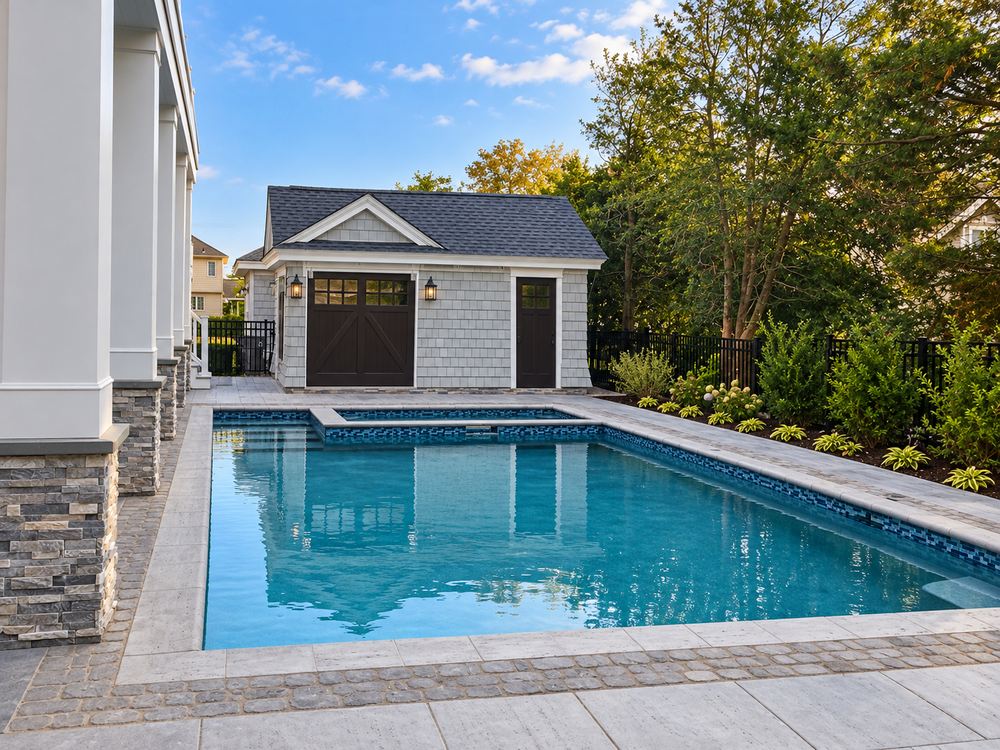 Gunite pool with a paver patio and a pool house with carriage-style doors at 141 99th St, Stone Harbor, NJ