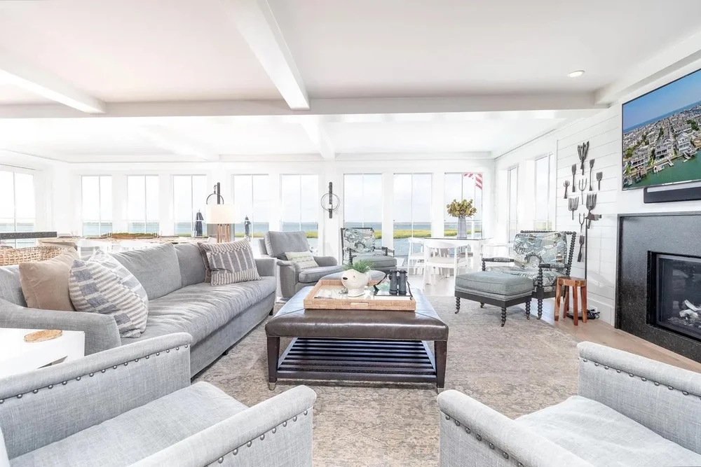 After: living room with a wall of windows overlooking the bay, 7708 Sunset, Avalon, NJ