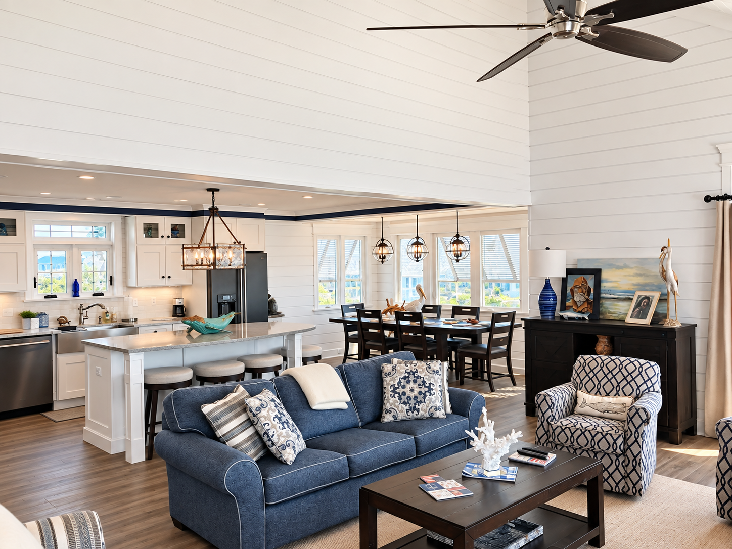 Great room, kitchen and dining area under a vaulted shiplap ceiling in the Sea Isle City duplex renovation