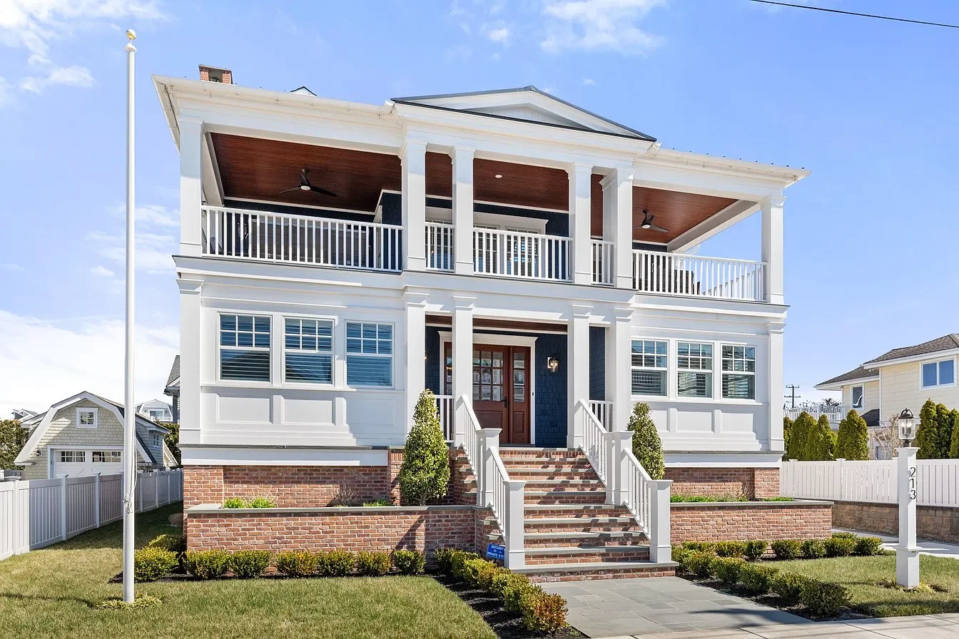 Front of the new three-story custom home with double covered porches, 213 57th St, Avalon, NJ