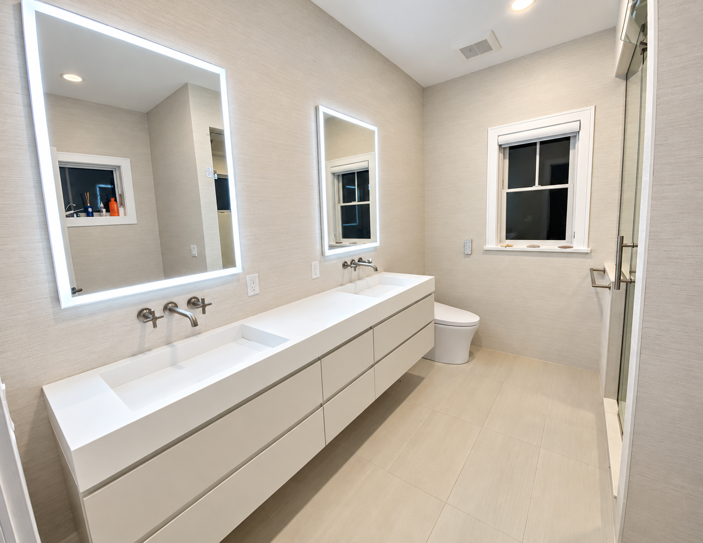 Bathroom with a floating double vanity and LED mirrors, 251 Crescent Rd, Ocean City, NJ