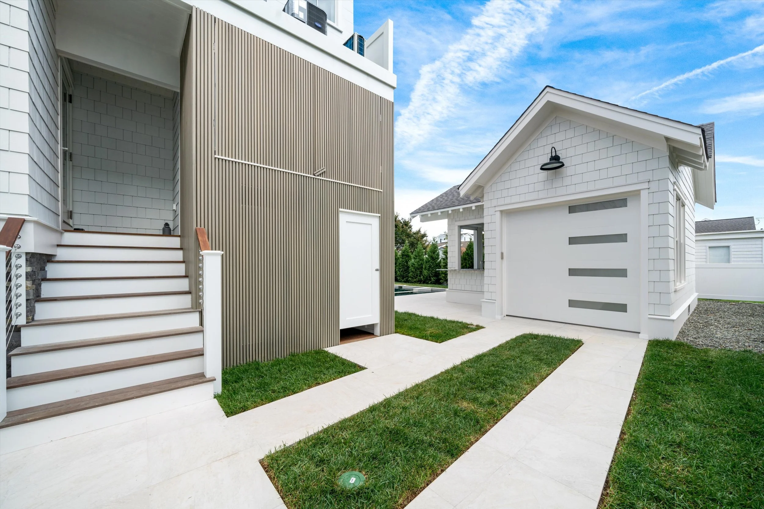 Side yard paver walkways leading to the pool house garage, 245 57th St, Avalon, NJ