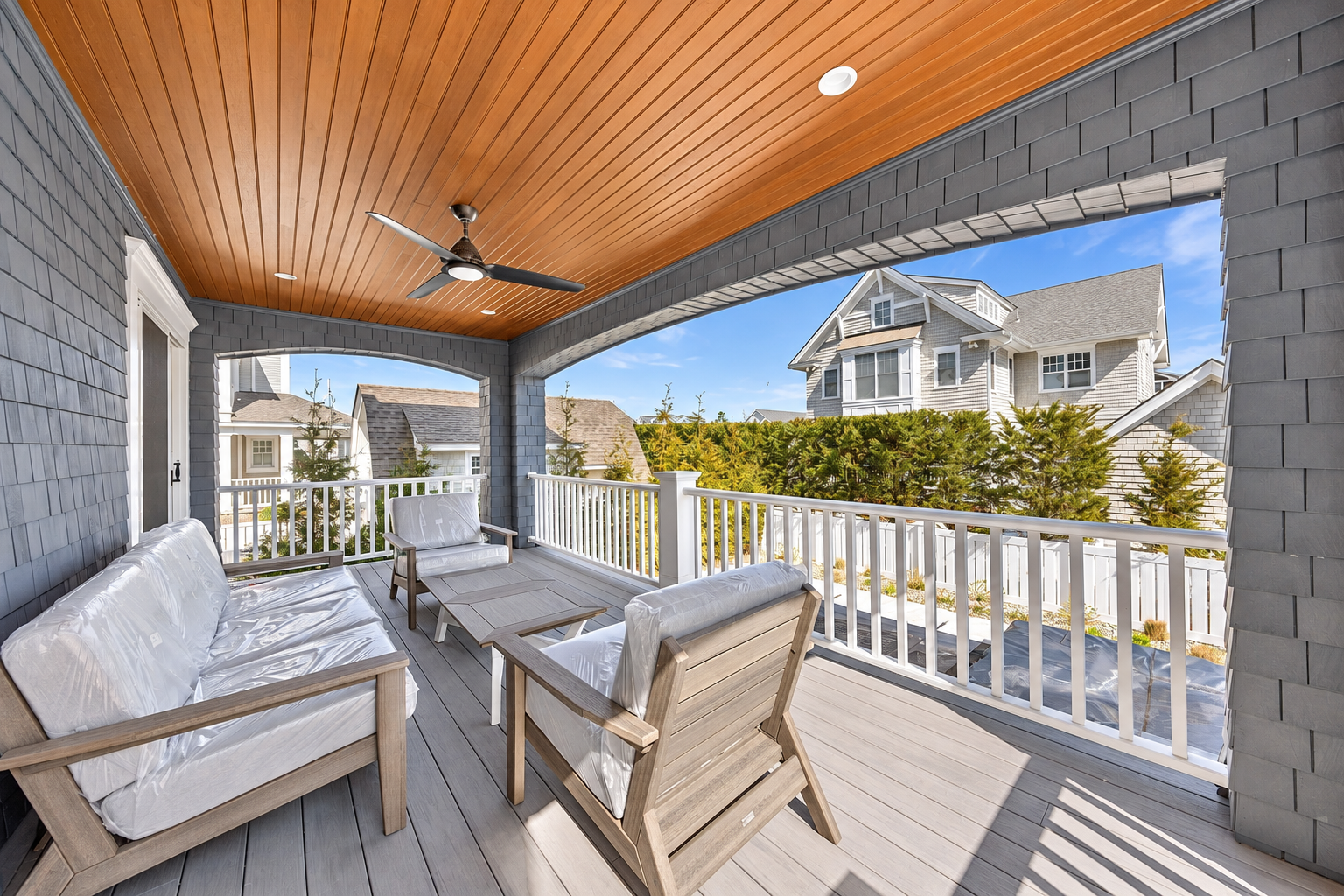 Covered rear deck with a wood plank ceiling and ceiling fan, 213 57th St, Avalon, NJ