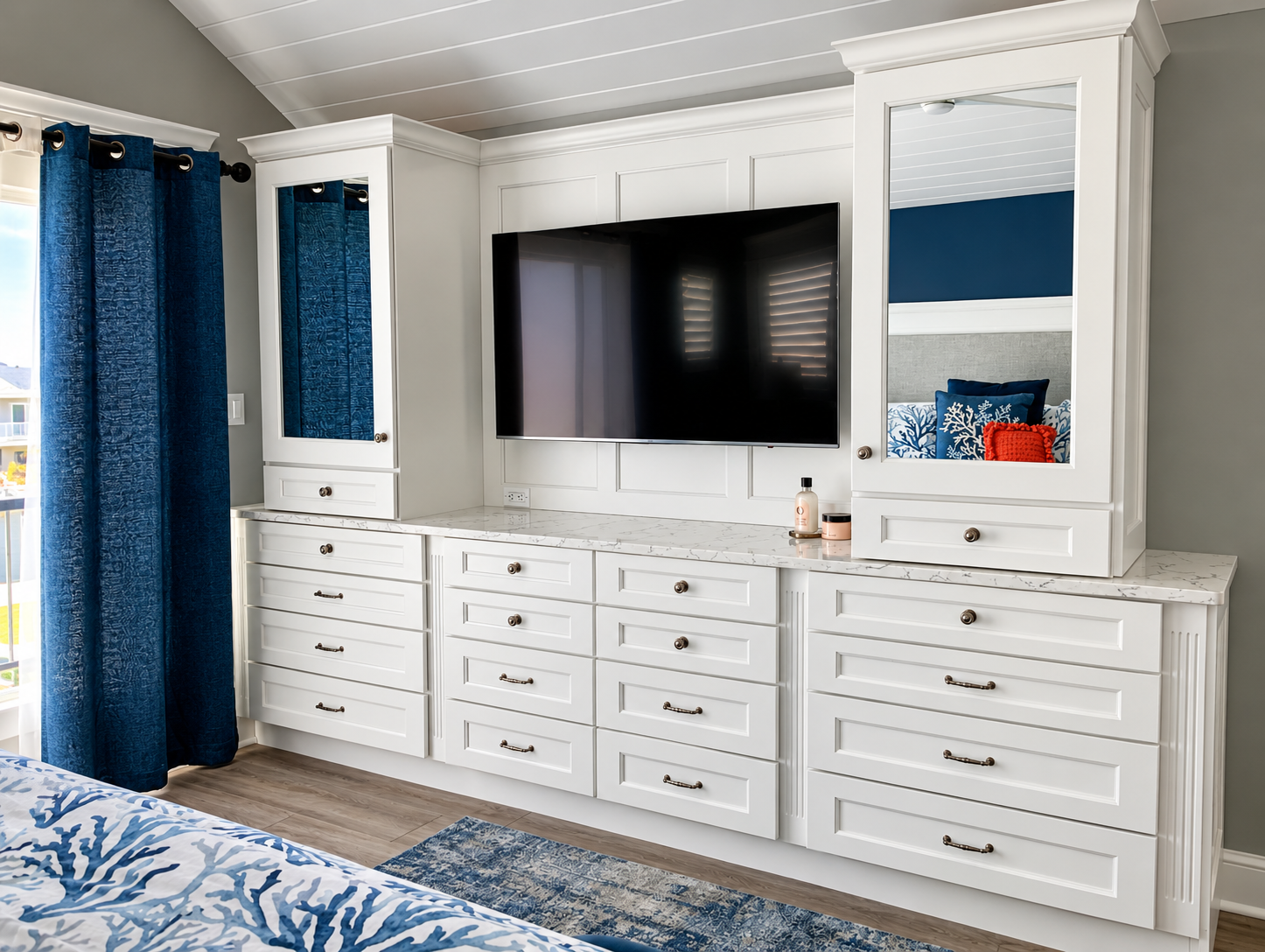 Bedroom with a custom built-in entertainment wall and dresser in the renovated Sea Isle City duplex