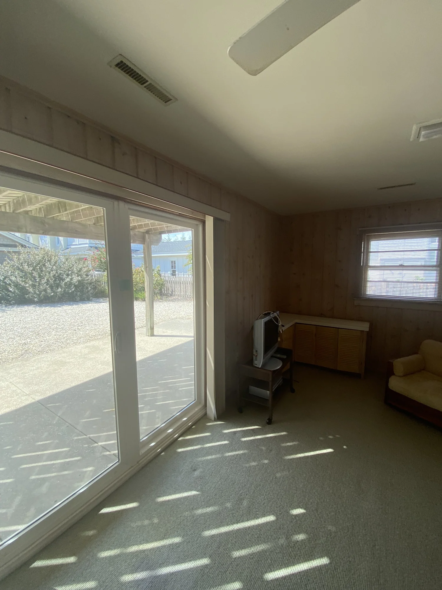 Before: old first-floor room with sliding doors, 107 116th St, Stone Harbor, NJ