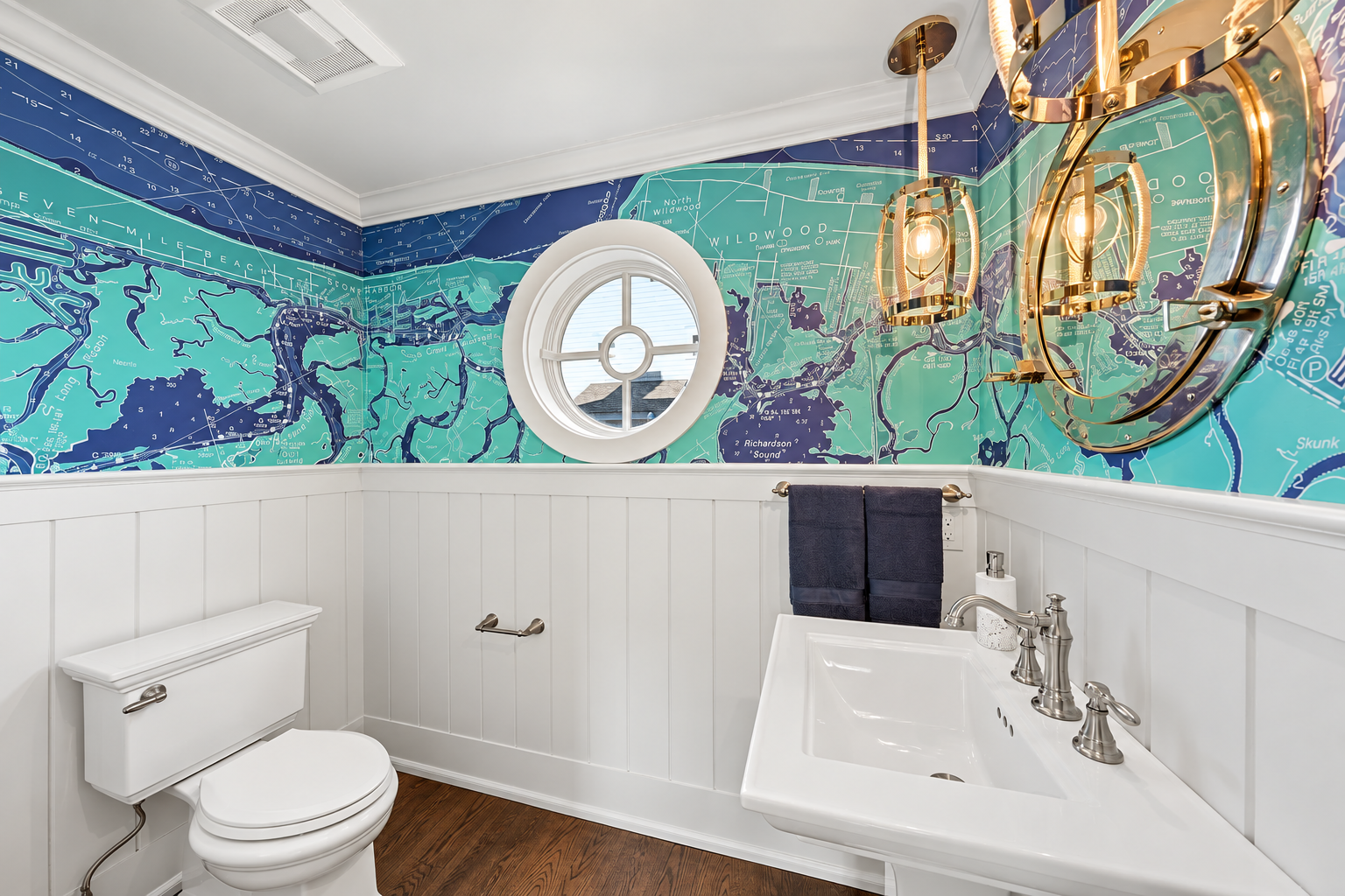 Powder room with nautical map wallpaper and a porthole mirror, 213 57th St, Avalon, NJ