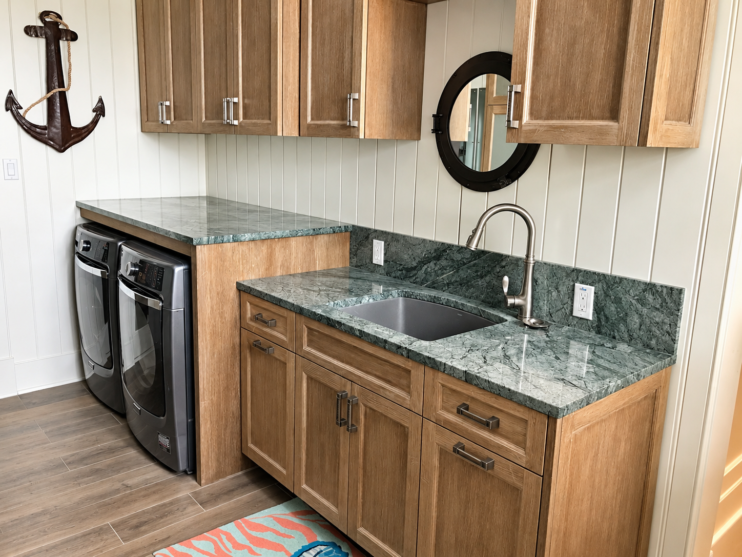 Laundry room with wood cabinets and anchor decor, Stone Harbor NJ custom home
