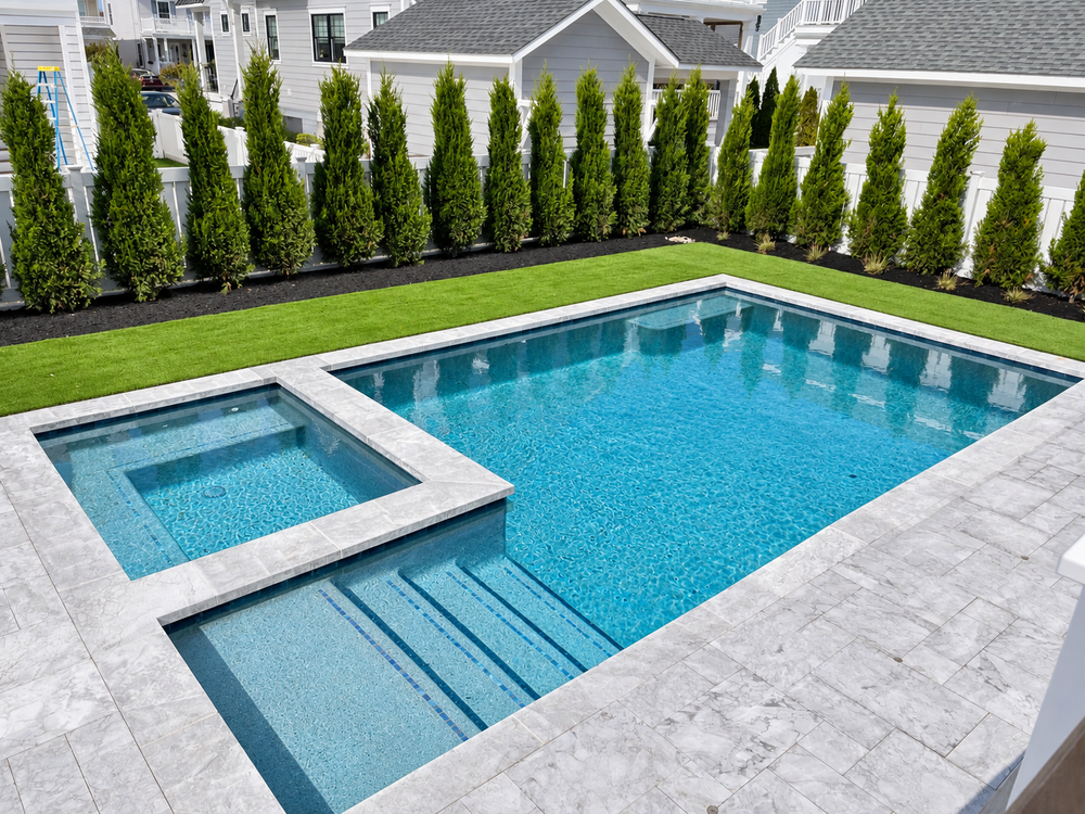 Custom gunite pool and spa with marble coping and patio in Stone Harbor, NJ