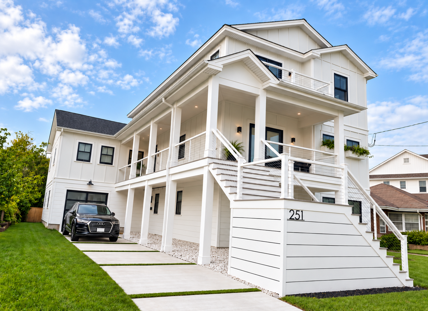 Front of the new custom home with covered porches, garage and new hardscaping, 251 Crescent Rd, Ocean City, NJ