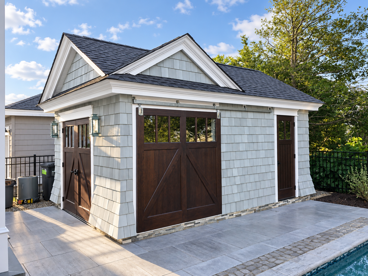 Pool house with carriage-style garage doors, Stone Harbor NJ custom home