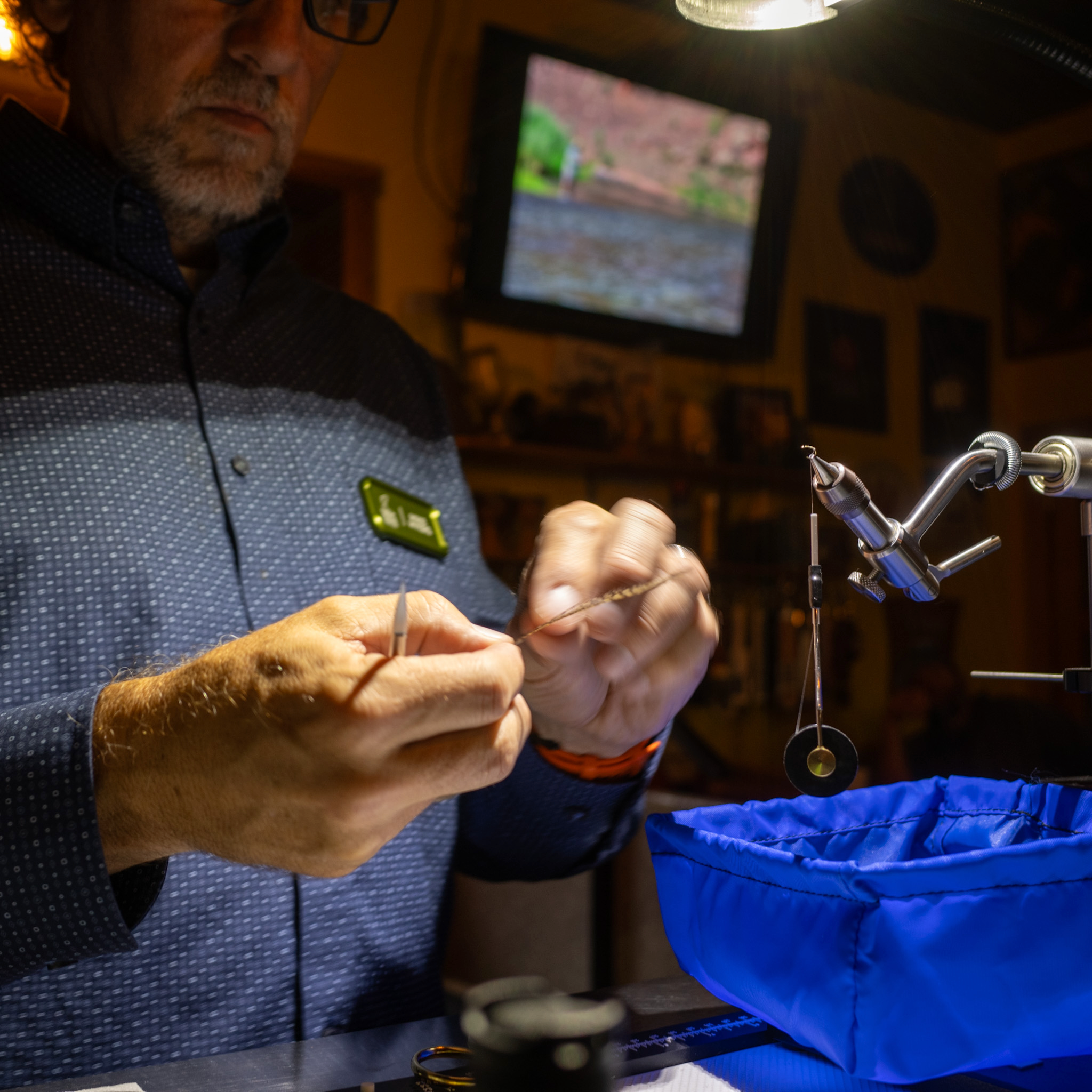Mike Myers demonstrating fly tying.