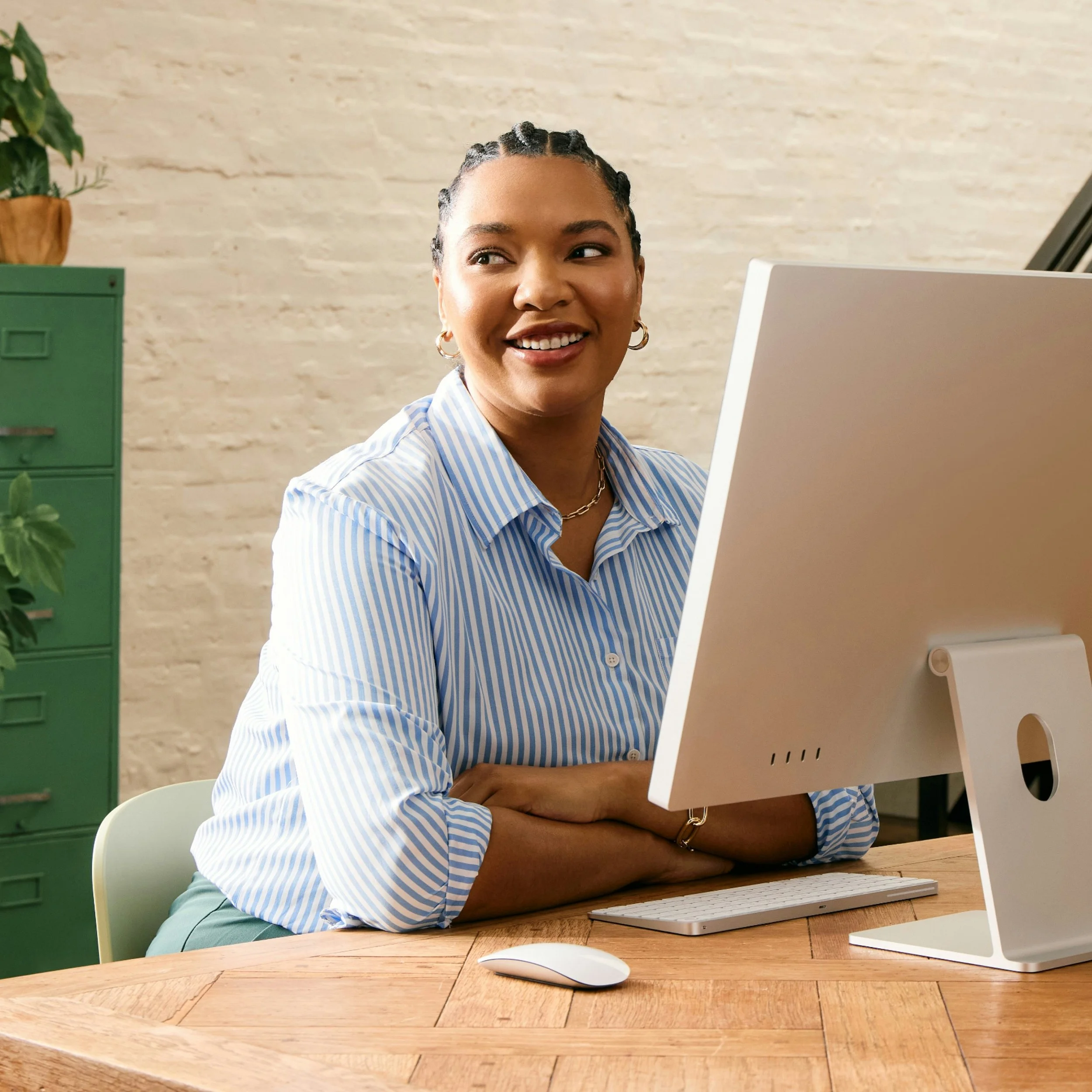 Smiling tech VA confidently building momentum for consistent, high-impact client work.