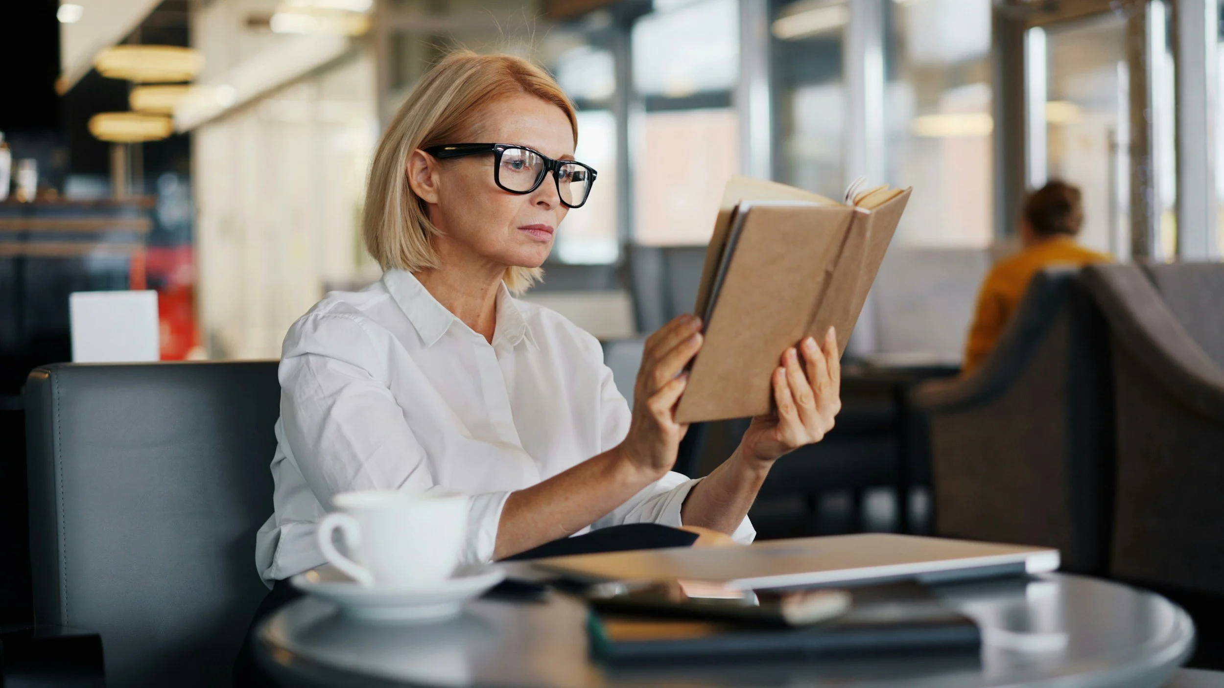 female VA reading book