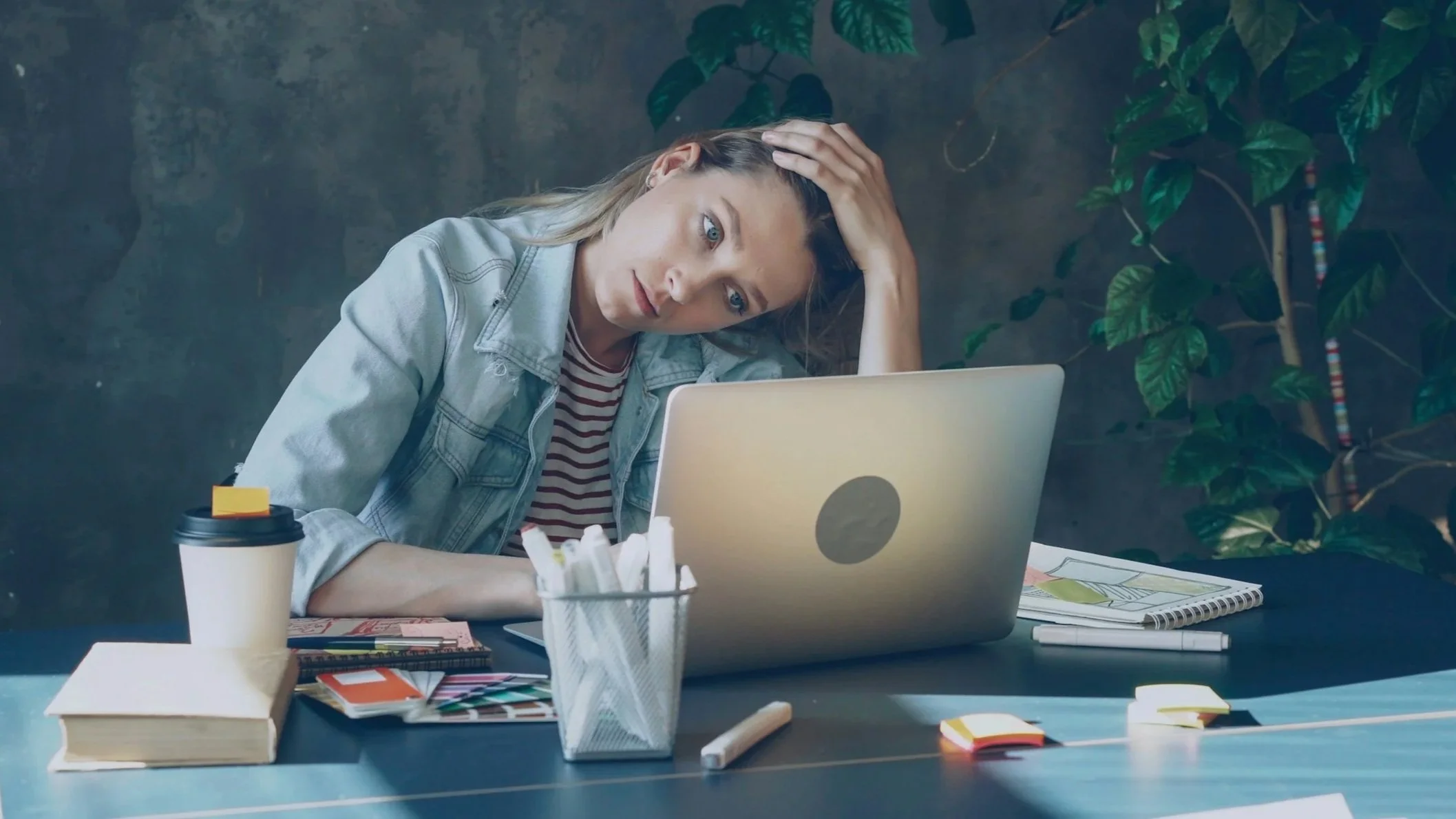 Stressed woman sitting at a laptop