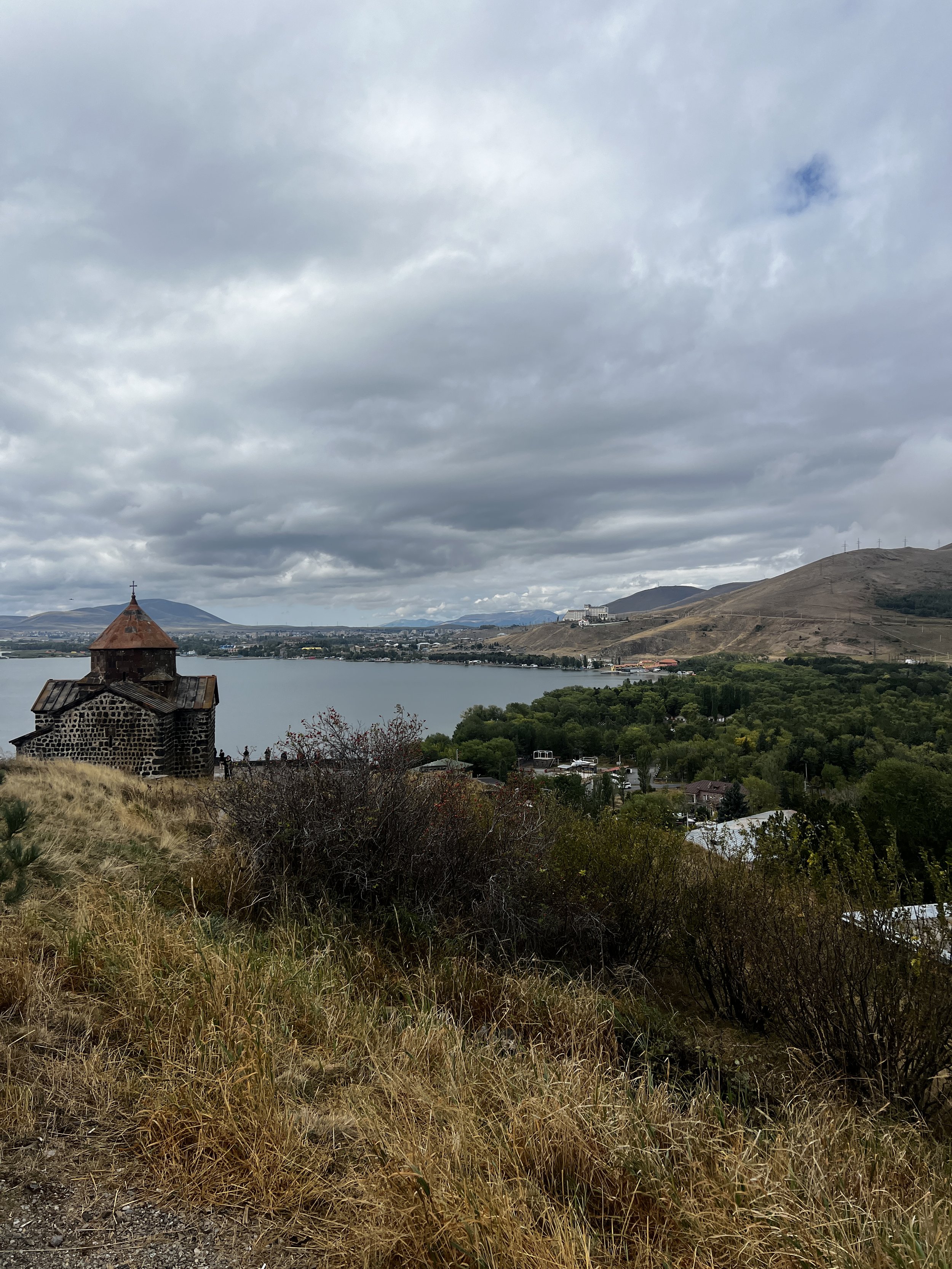 lake sevan and a monastery in Armenia showing the landscape