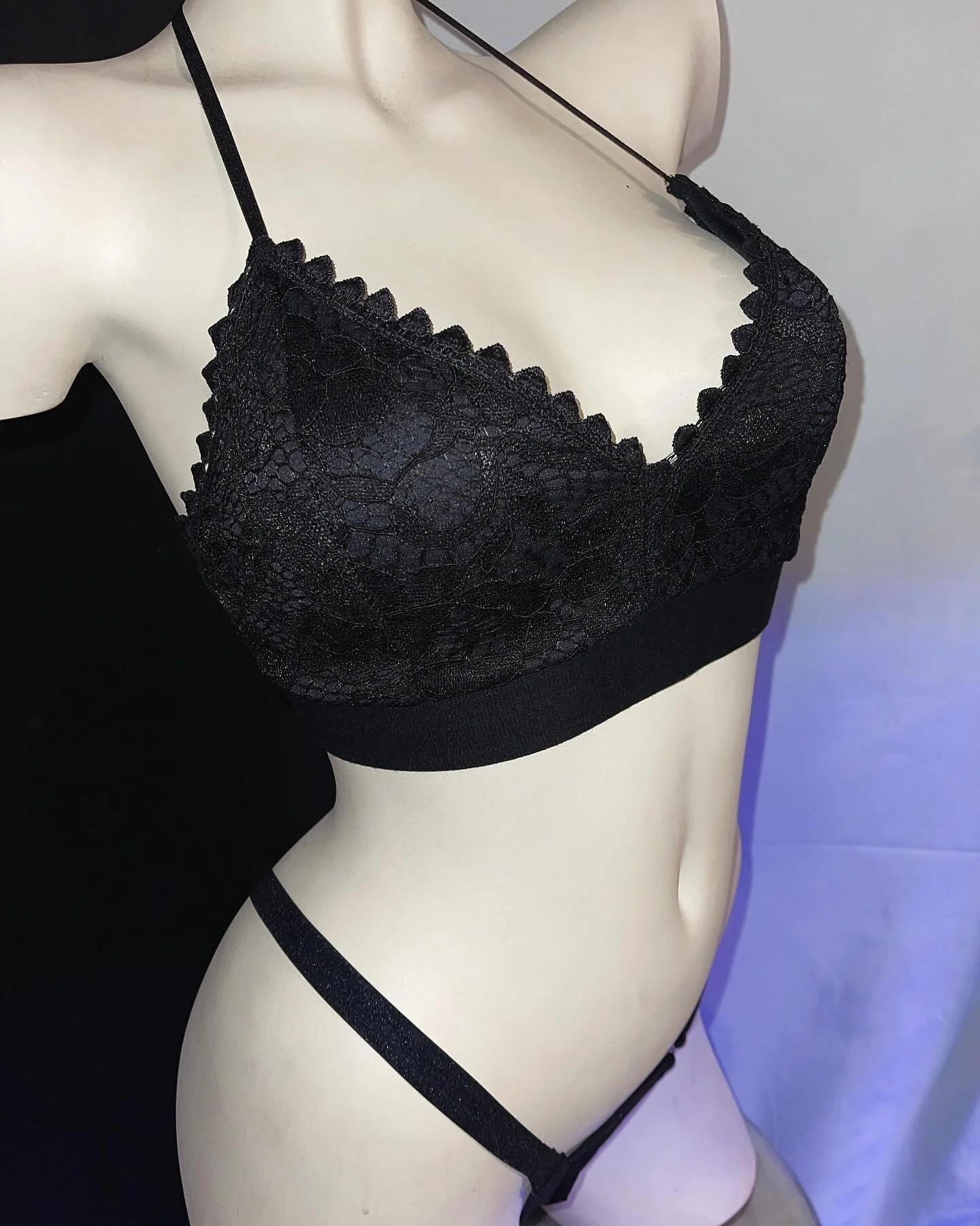 Mannequin wearing black lace lingerie set