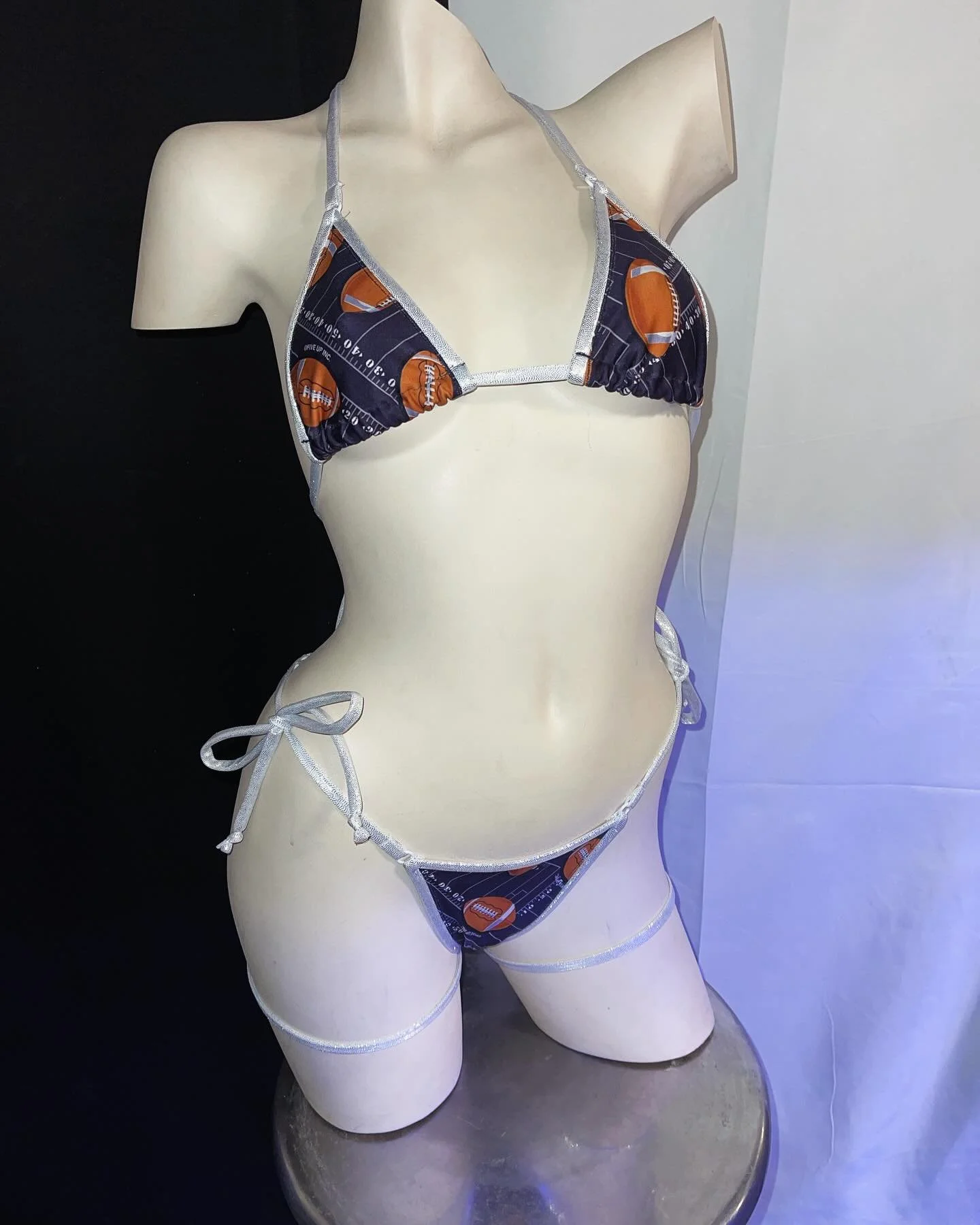 Mannequin wearing a bikini with a football design