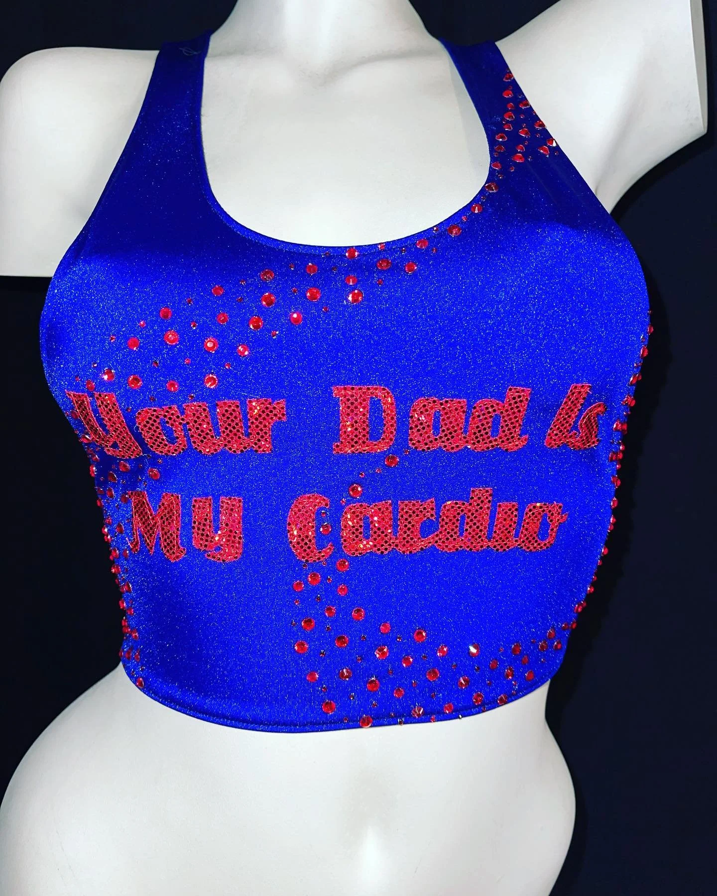 Blue sleeveless top with red rhinestone text "Your Dad is My Cardio" displayed on a mannequin torso.