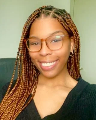 Marriage and Family Therapist Tyler wearing a black T-Shirt