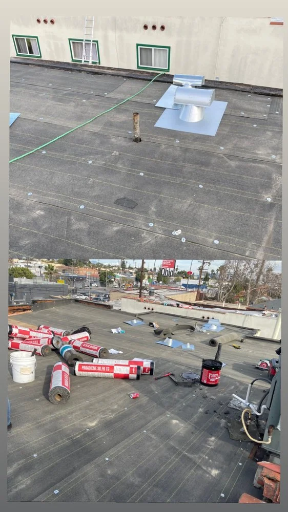 Re-roof a flat roof with new torch down roofing system.jpg