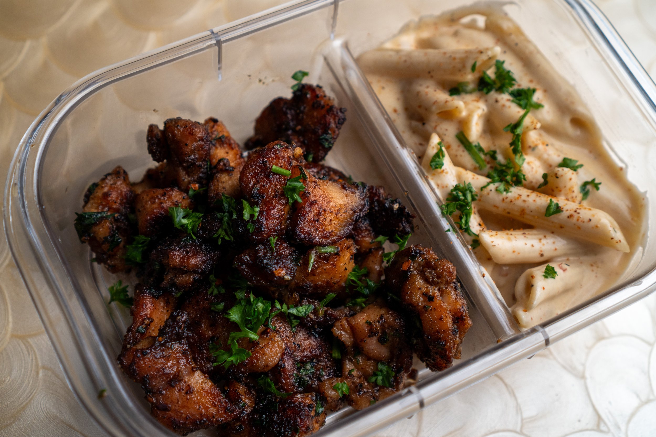 Nashville hot chicken bites with creamy Cajun mac and cheese.