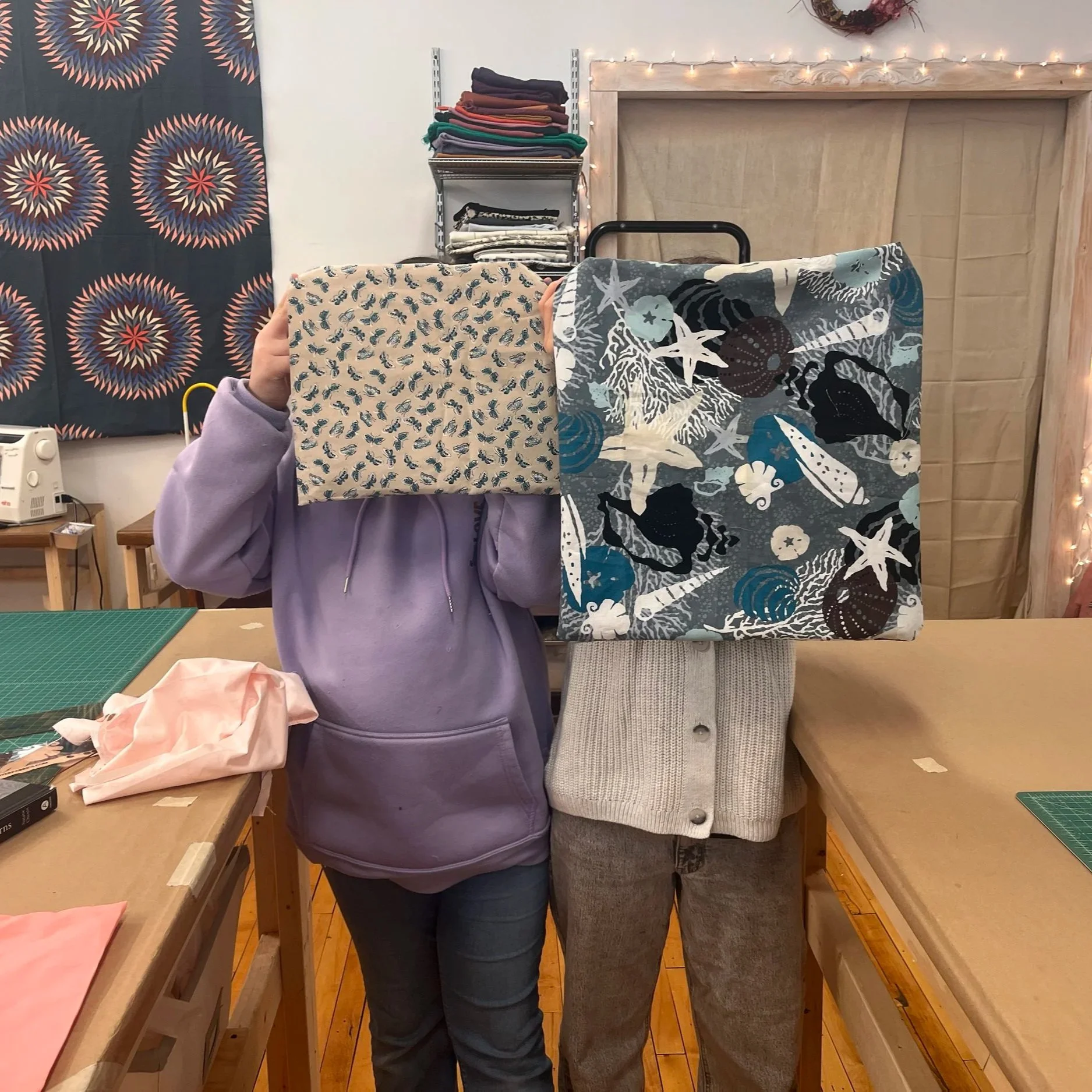 Two young friends making pillows on pillows in private lesson.