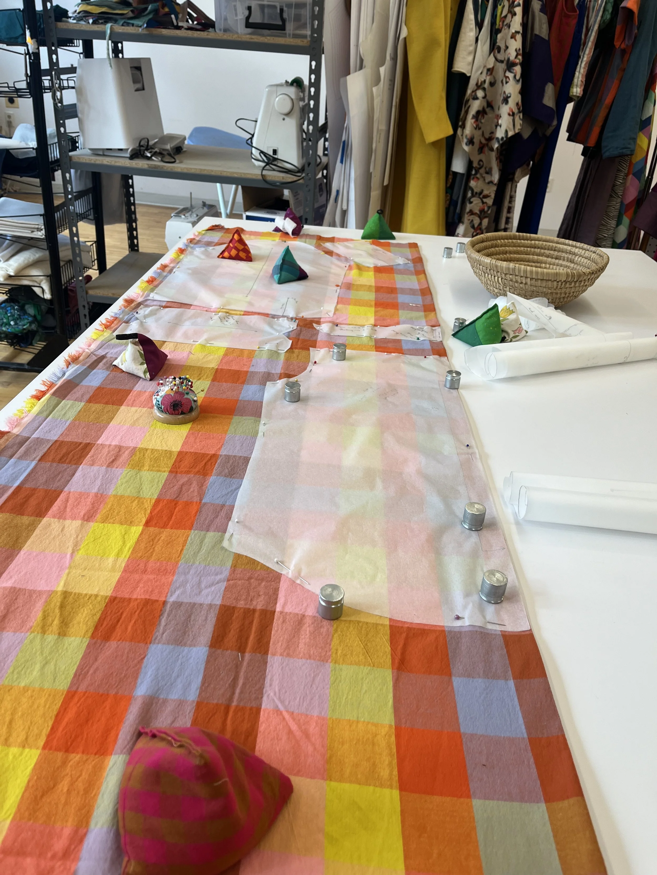 Fabric being prepared for cutting out shirt pieces