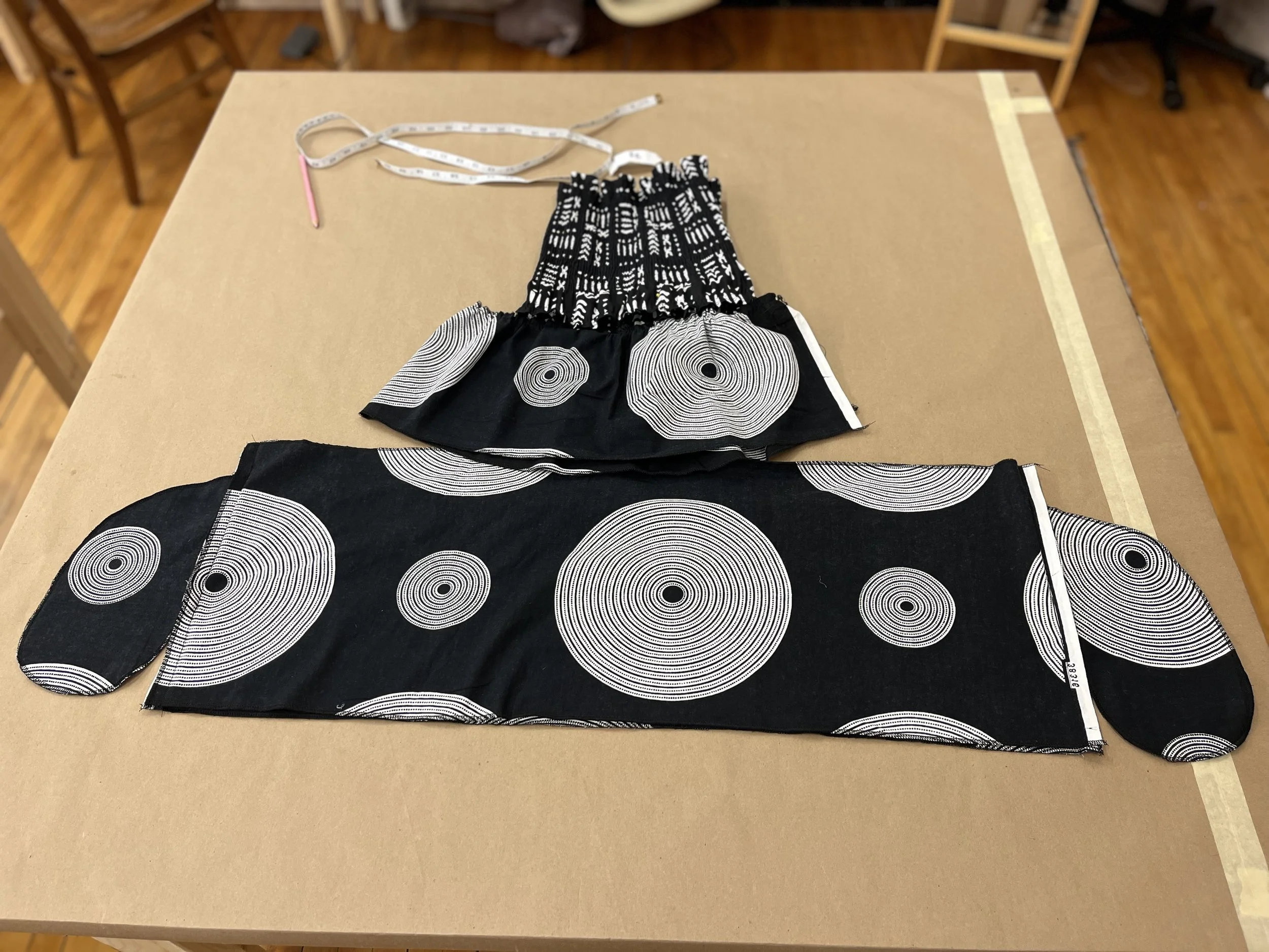 Laying out dress pieces in order and lining up seams
