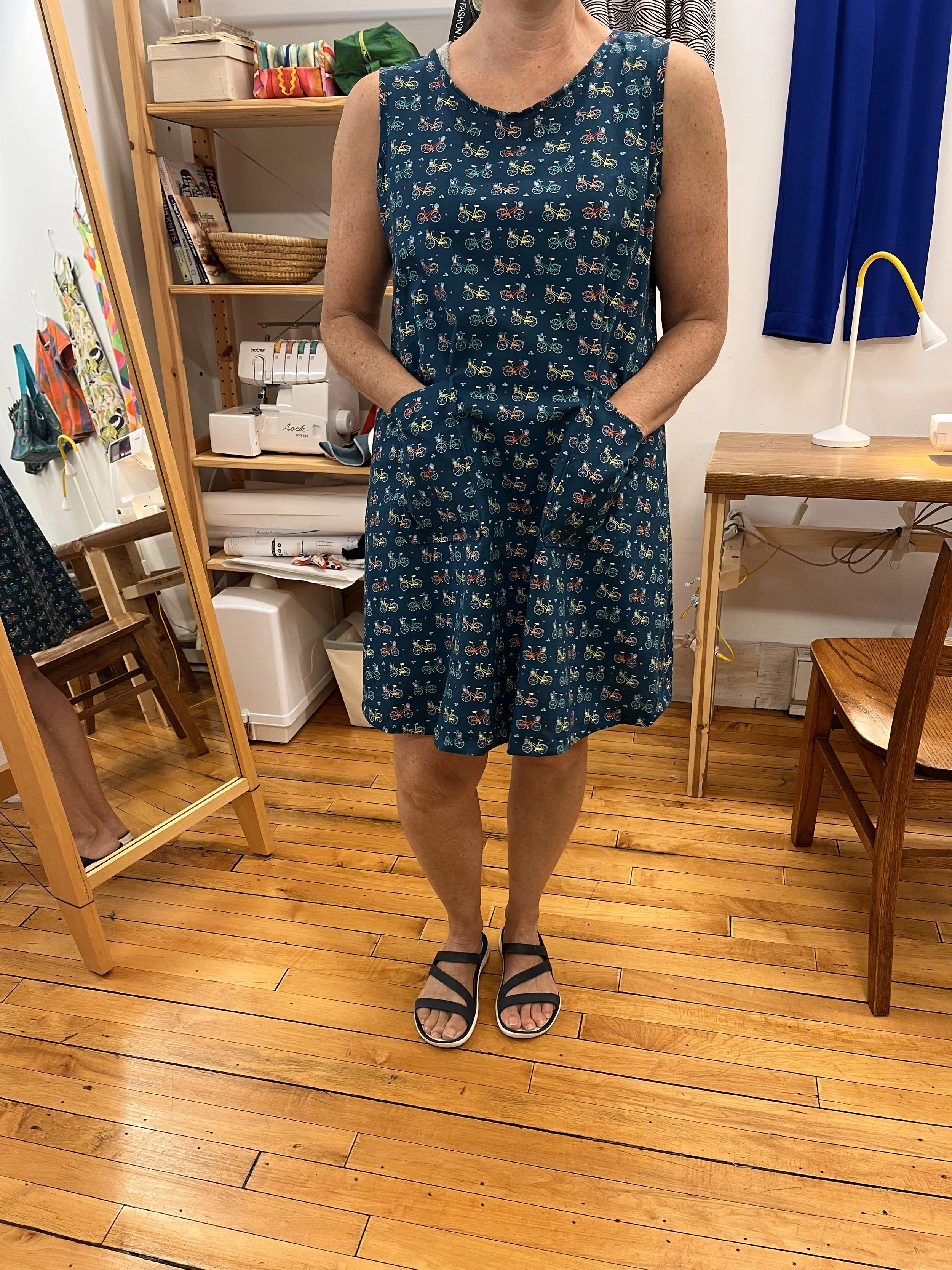 A fun house dress made of bicycle-themed fabric in a Grove house sewing class