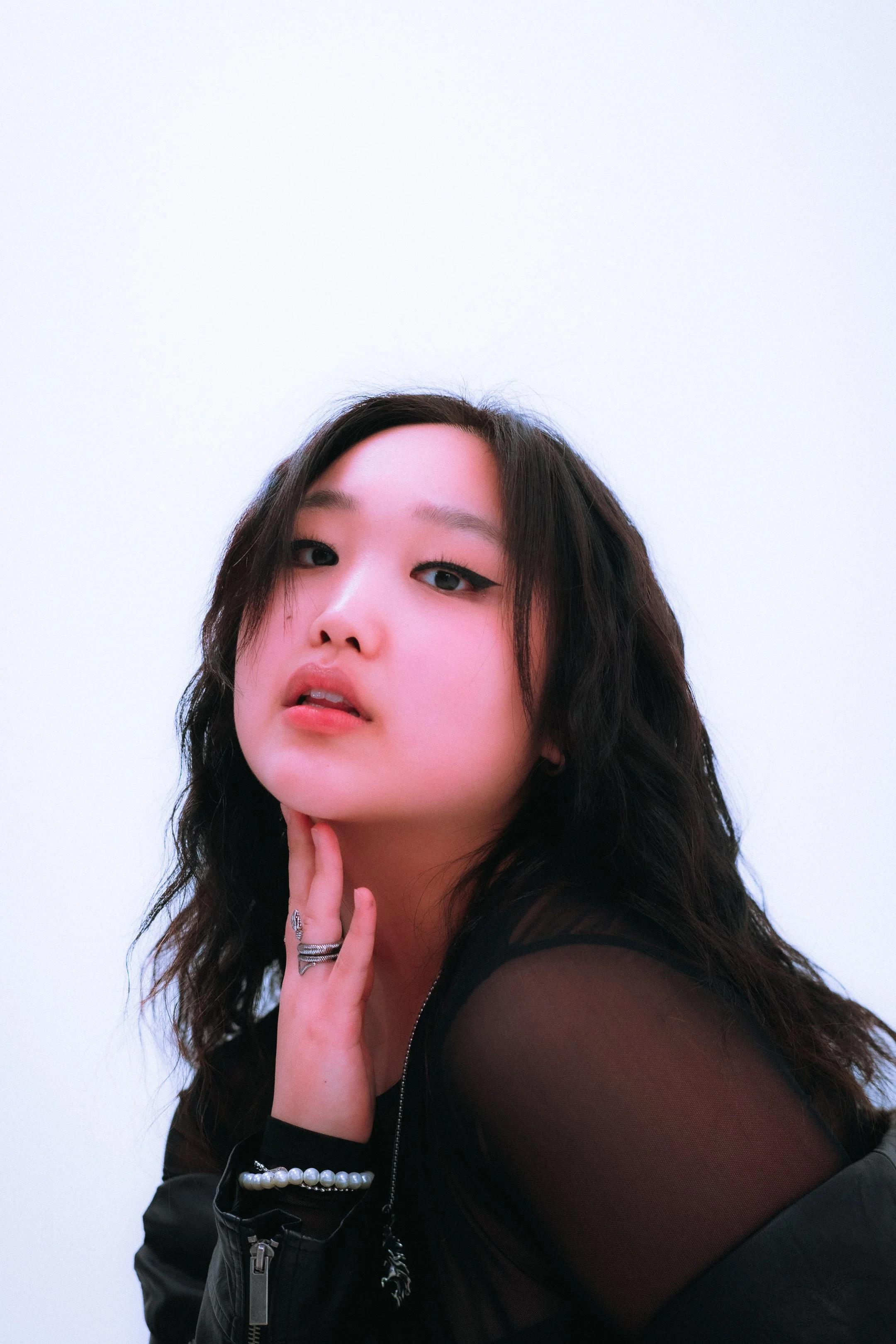 young woman poses for professional portraits in Dallas 