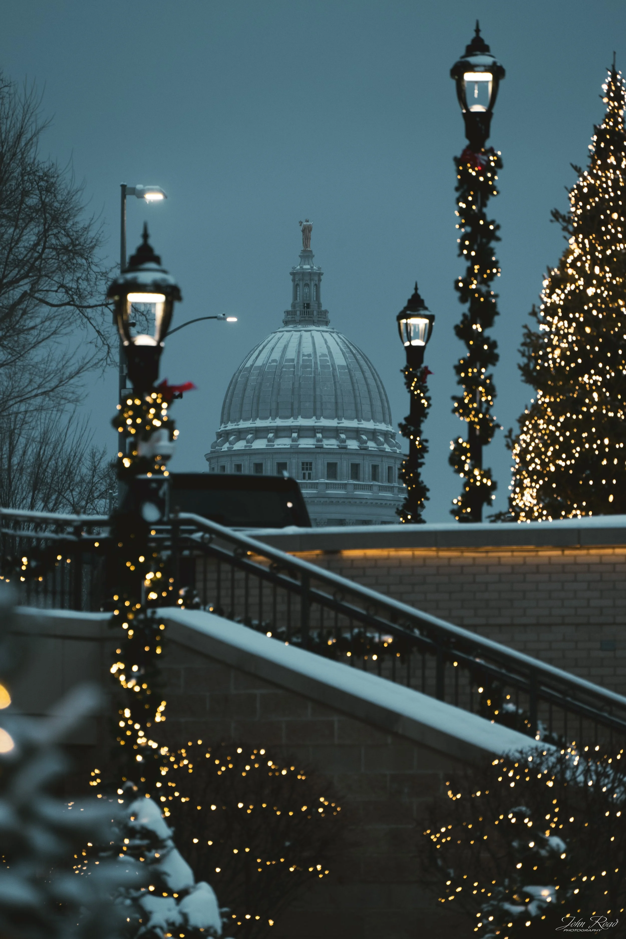 Wisconsin State Capitol decorated for Christmas with holiday lights and snow in Madison, winter photography by John Road.