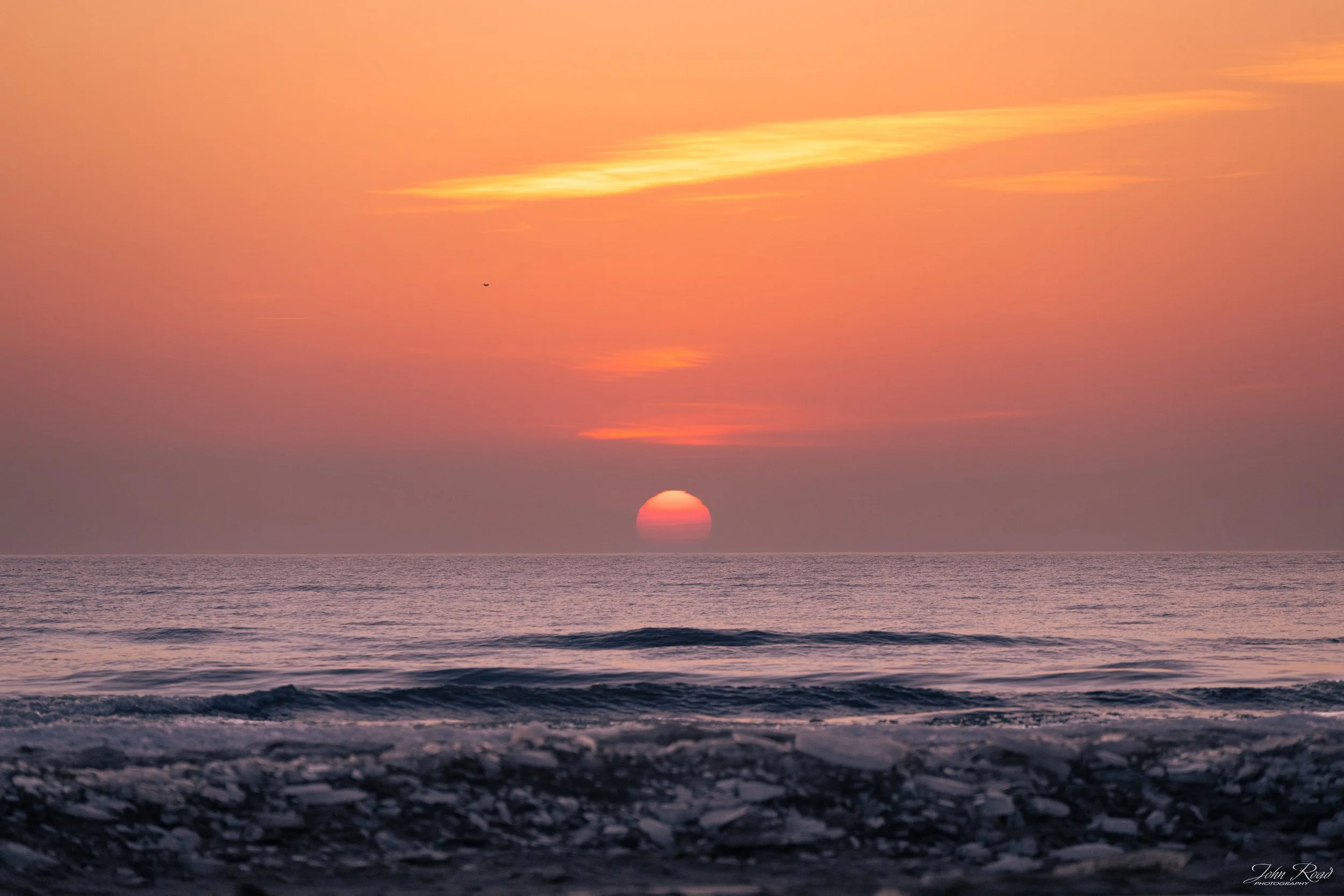 Frozen Dawn winter sunrise over icy waters and frost-covered landscape, photograph by John Road, available on metal, canvas, and luster paper.