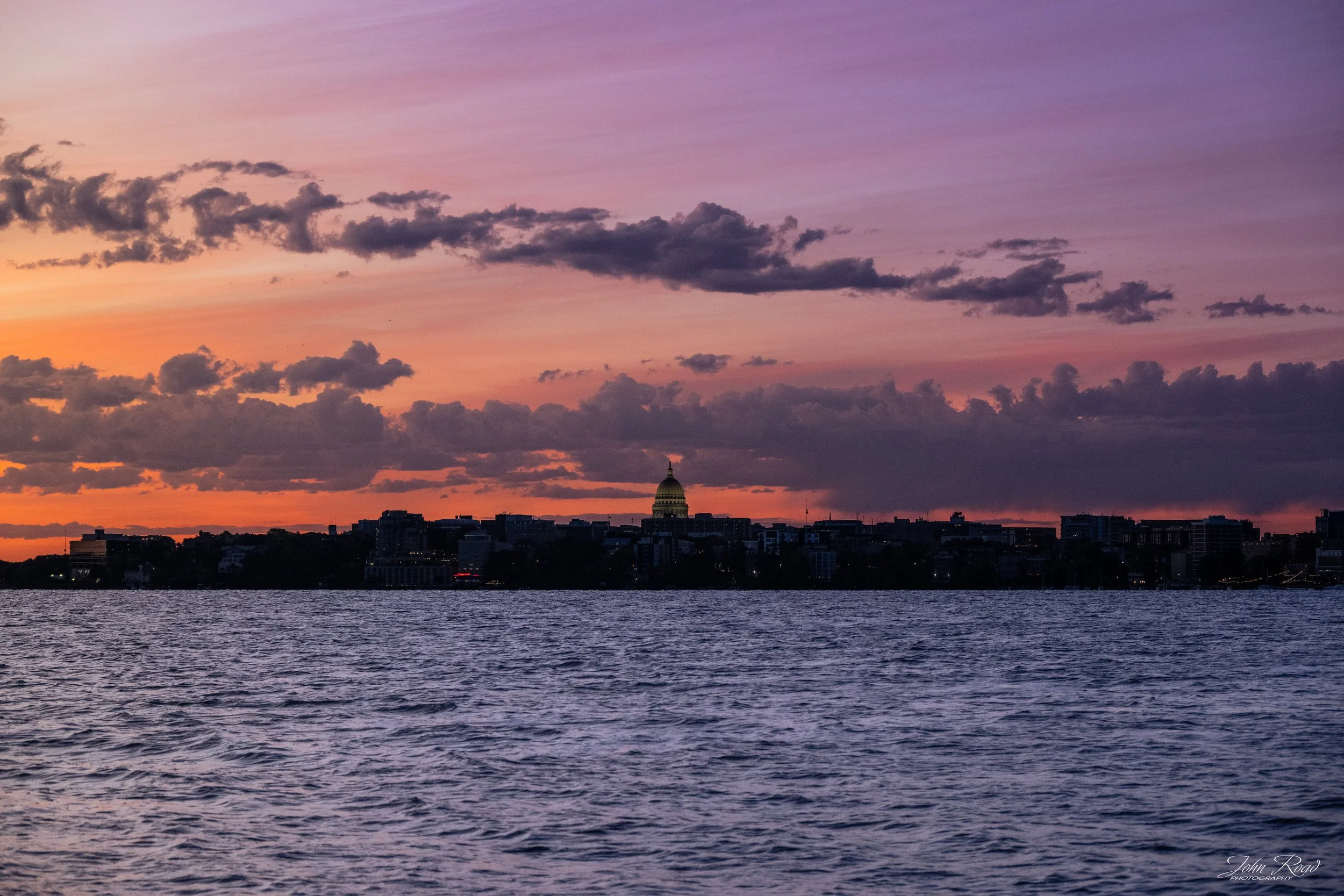Madison skyline and Wisconsin State Capitol at sunset across Lake Monona