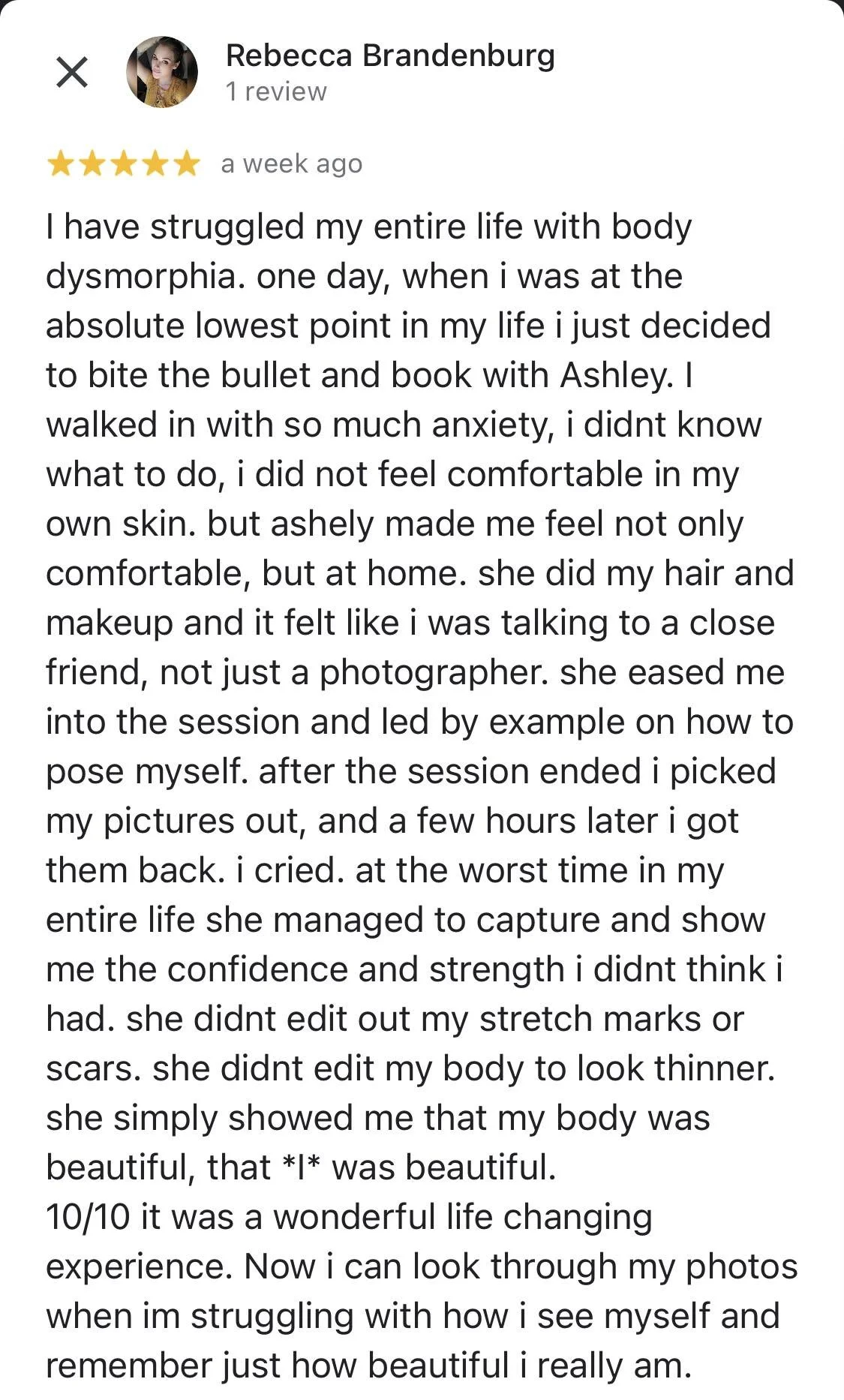 Screenshot of a five-star review by Rebecca Brandenburg describing her positive experience with a portrait photography session with Ashley, highlighting improved self-confidence and body image.