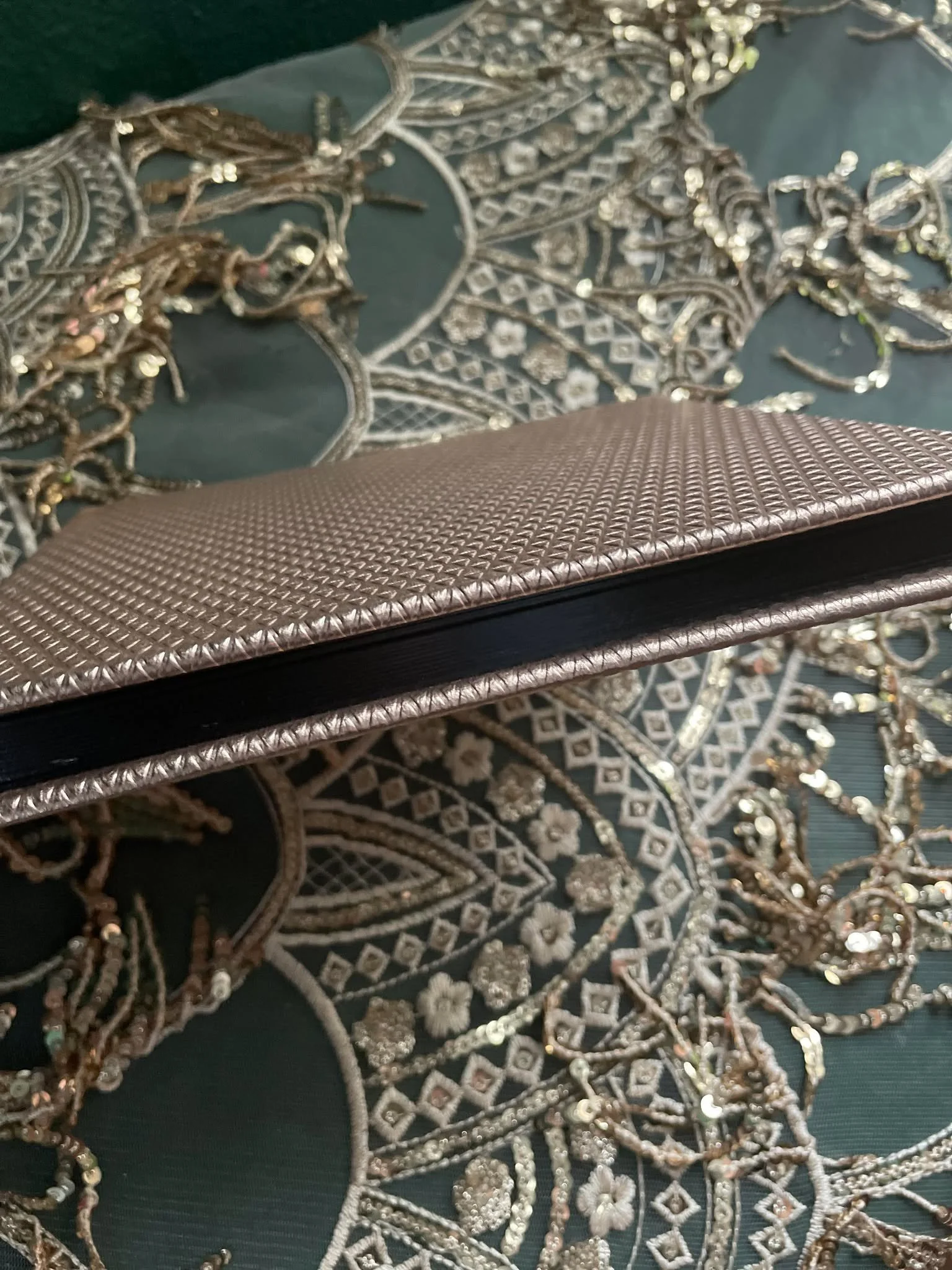 Gold textured leather album with black gilding