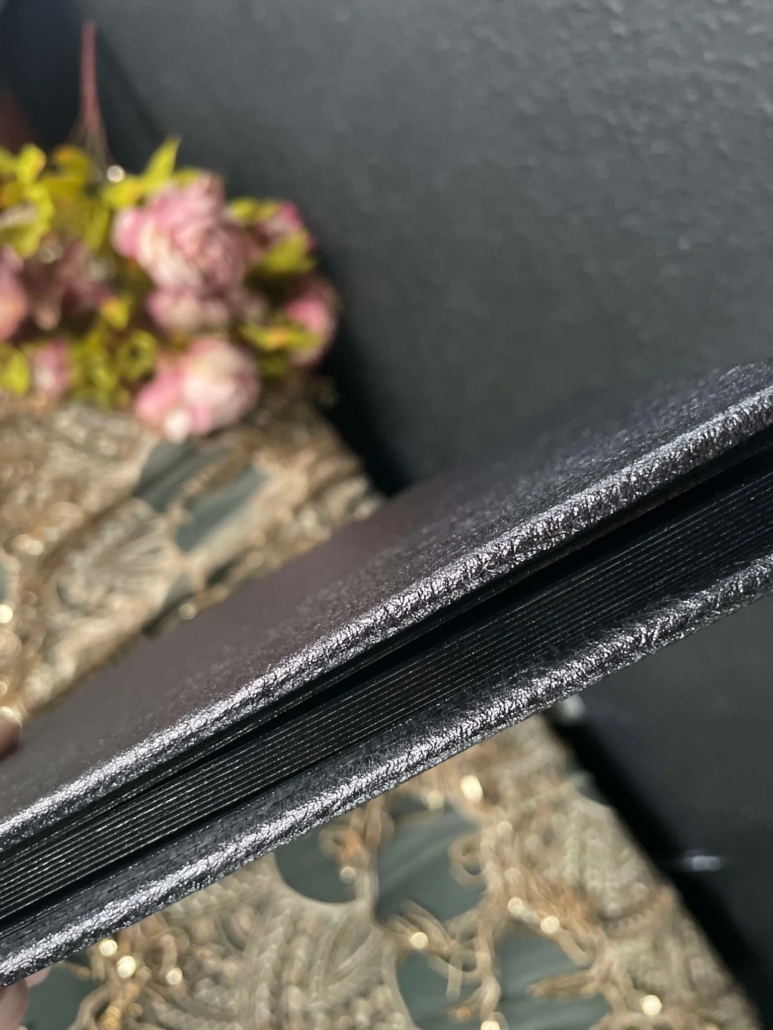 Black textured album with black gilding