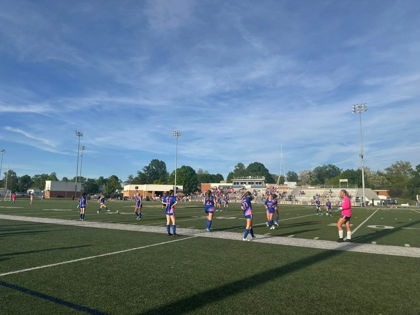 The @qhsgirlssoccerrr team takes on the qndgirlssoccer team for pink night here at QND!