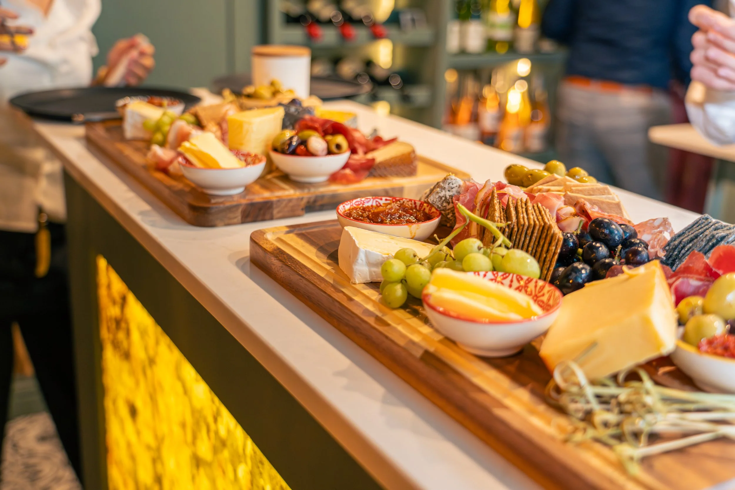 Charcuterie boards with wine backdrop