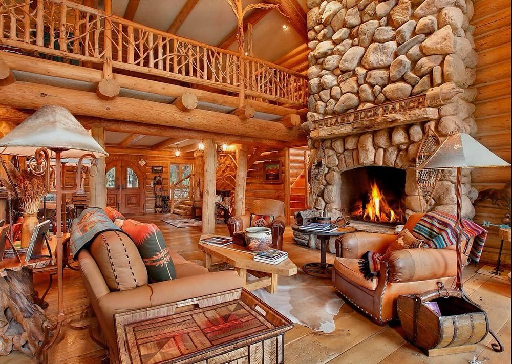 SHOOT LOCATION HRE12 | montana meets hamptons | western-style log cabin ranch on 18 acres | 7,000 sq. ft. log home with mexican double door + timber-trussed cochere | red-cedar logs | barn-wood flooring | double-height living room with stone fireplac