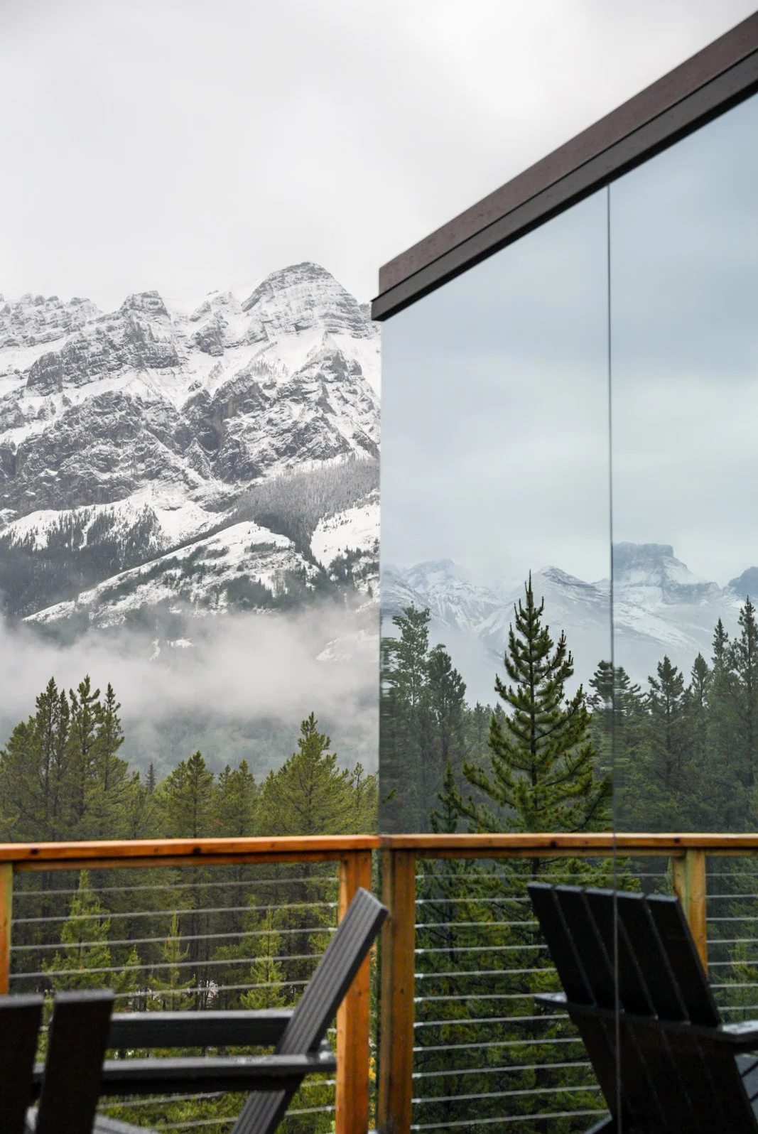 Skyglass-mirror window reflection-hanging clouds-mountain.jpeg