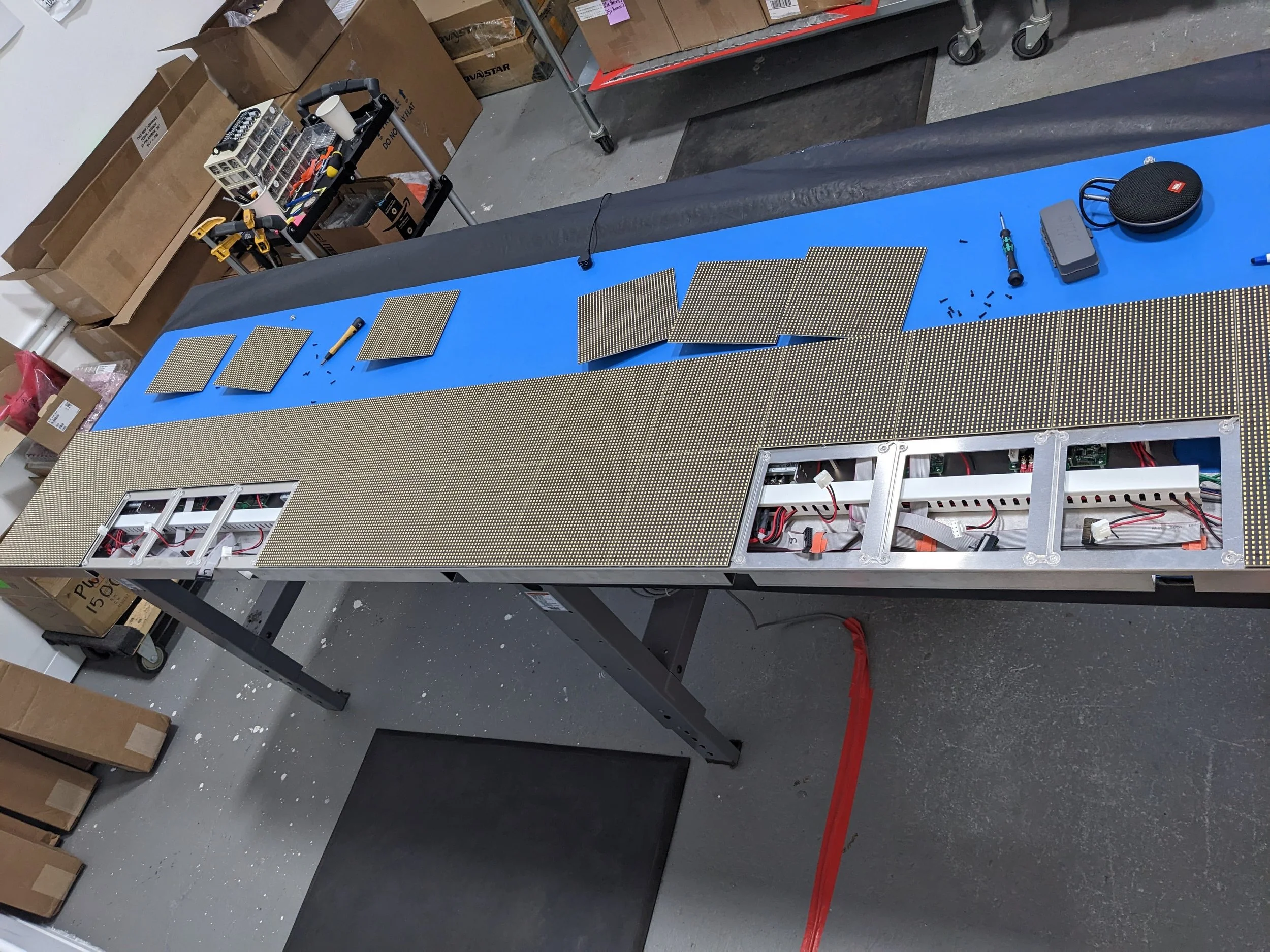 LED Tiles screwed onto assembly. There were custom laser-cut acrylic spacers to prevent interference between the LED Tiles and electrical components beneath. 