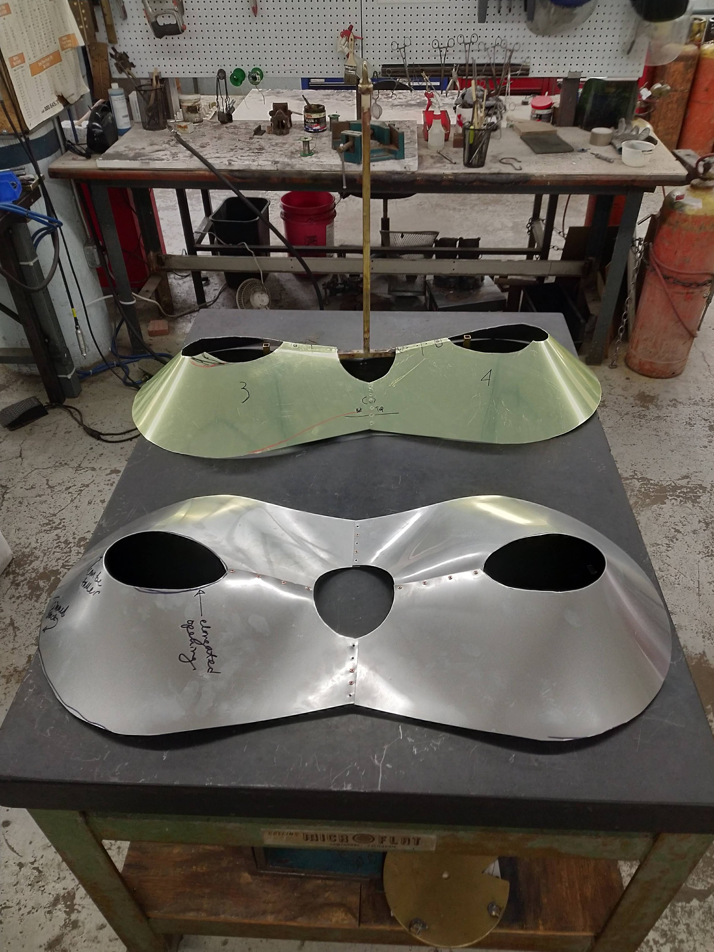 Two aluminum Sheet Metal Shade prototypes side by side