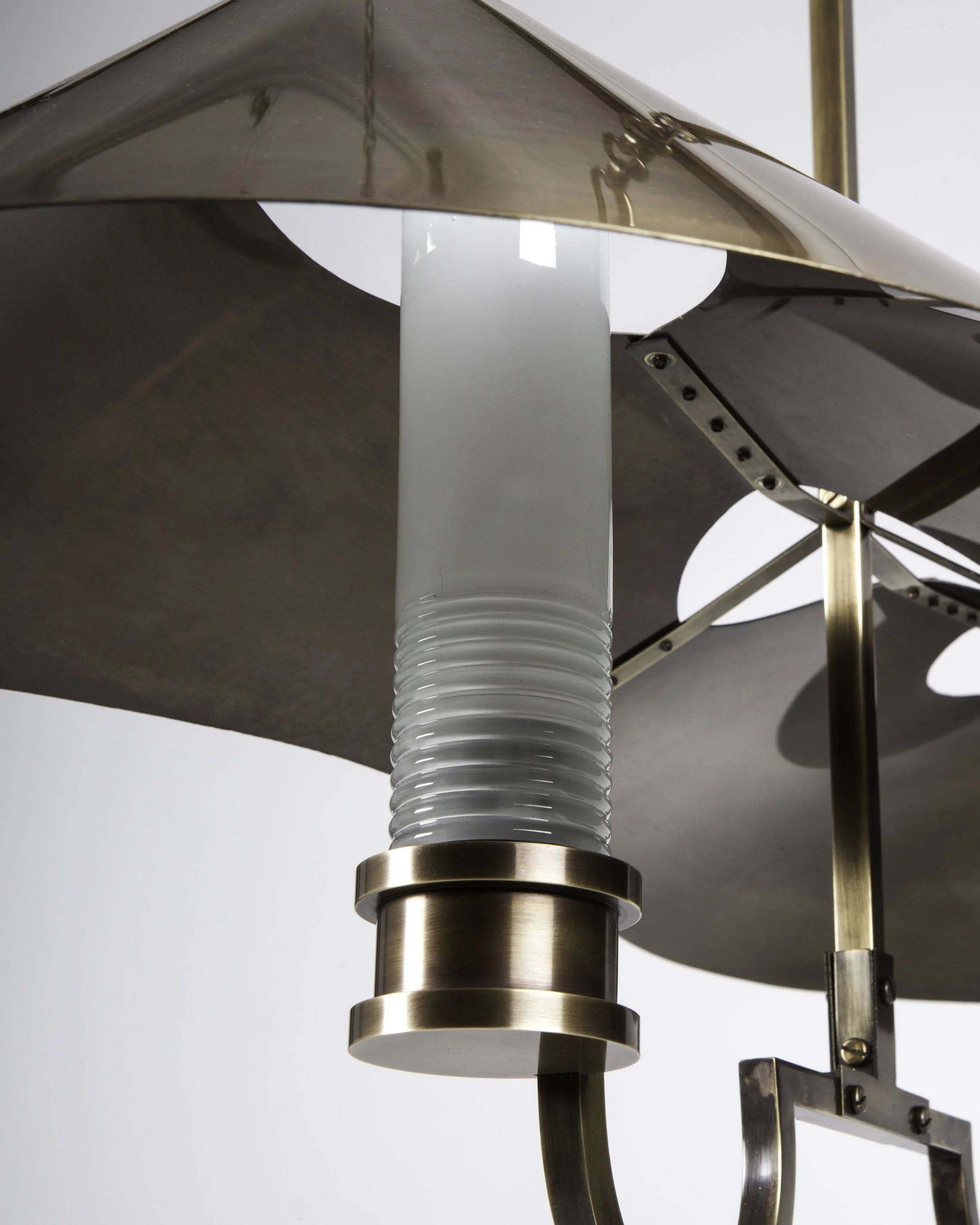 Detail shot of Glass Shade in Base and underside of Brass Shade with riveted support
(Photo credit: Remains Lighting)