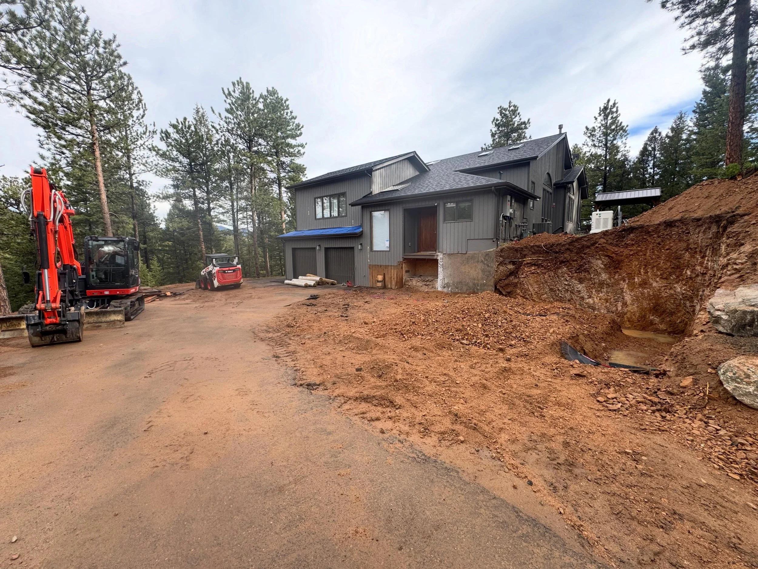 Work! This week The Boyz supported a crew of hard working contractors completing a major remodel on a home on the Evergreen / Conifer border which involved removing large amount of soil, clay, and rock. Combing the raw power of our 20,000lbs KX080-5 